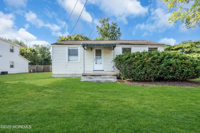 a kitchen that has a table and a stove in it