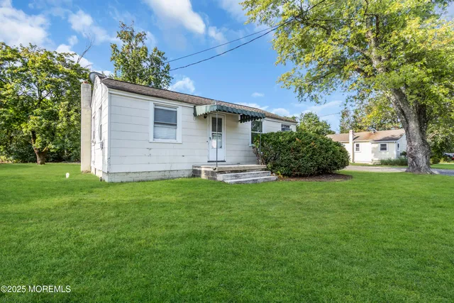 a kitchen with a refrigerator and cabinets