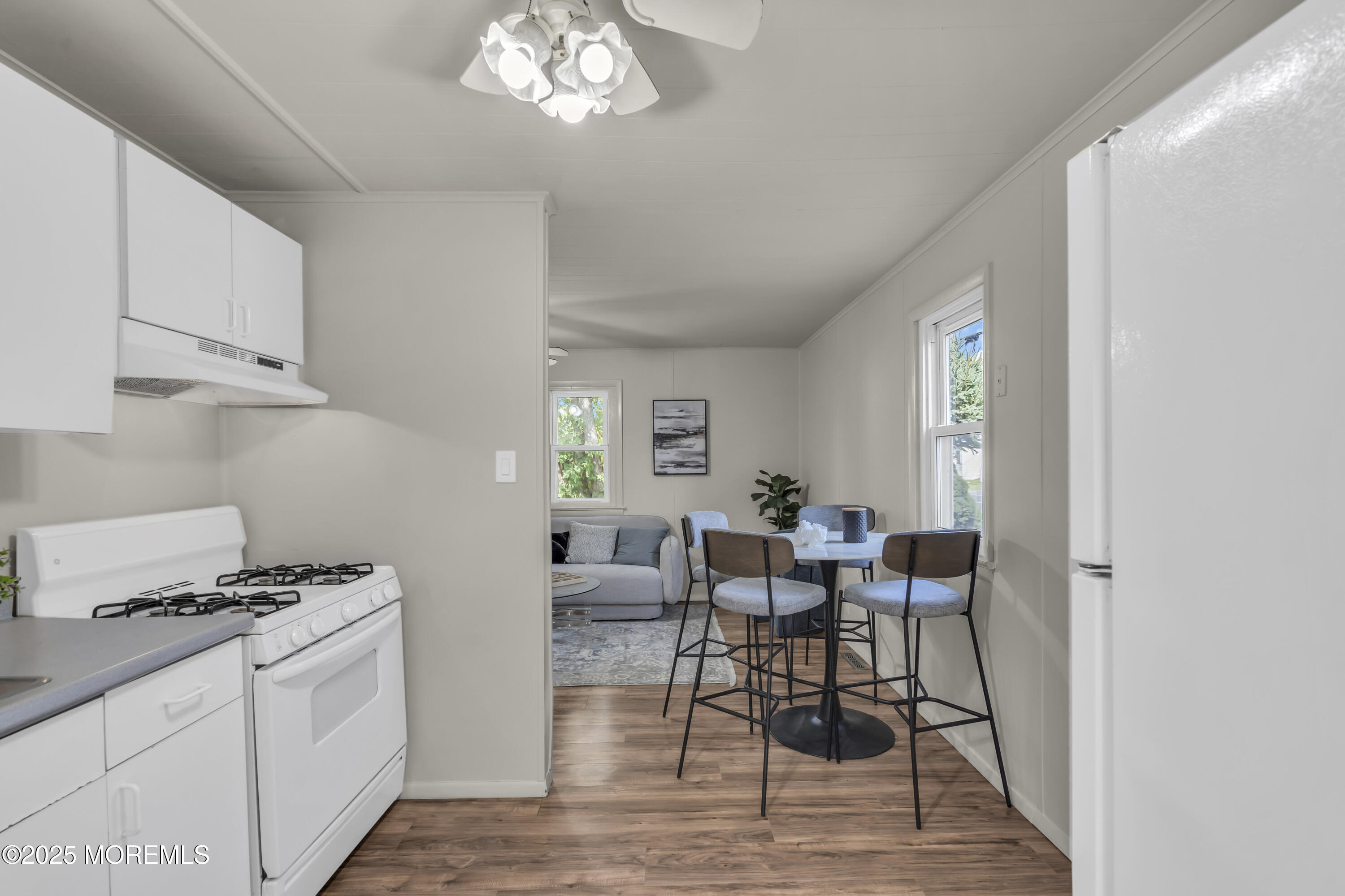 70-72 Jacobstown Road New Egypt, NJ 08533 - Photo 43 of 72 a kitchen with stainless steel appliances a dining table chairs and a window