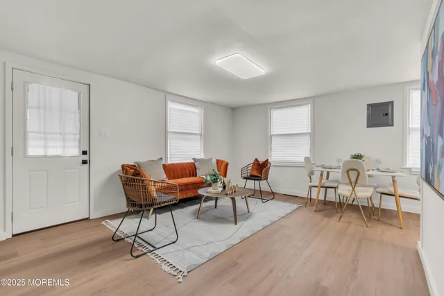 a view of a dining room with furniture and window