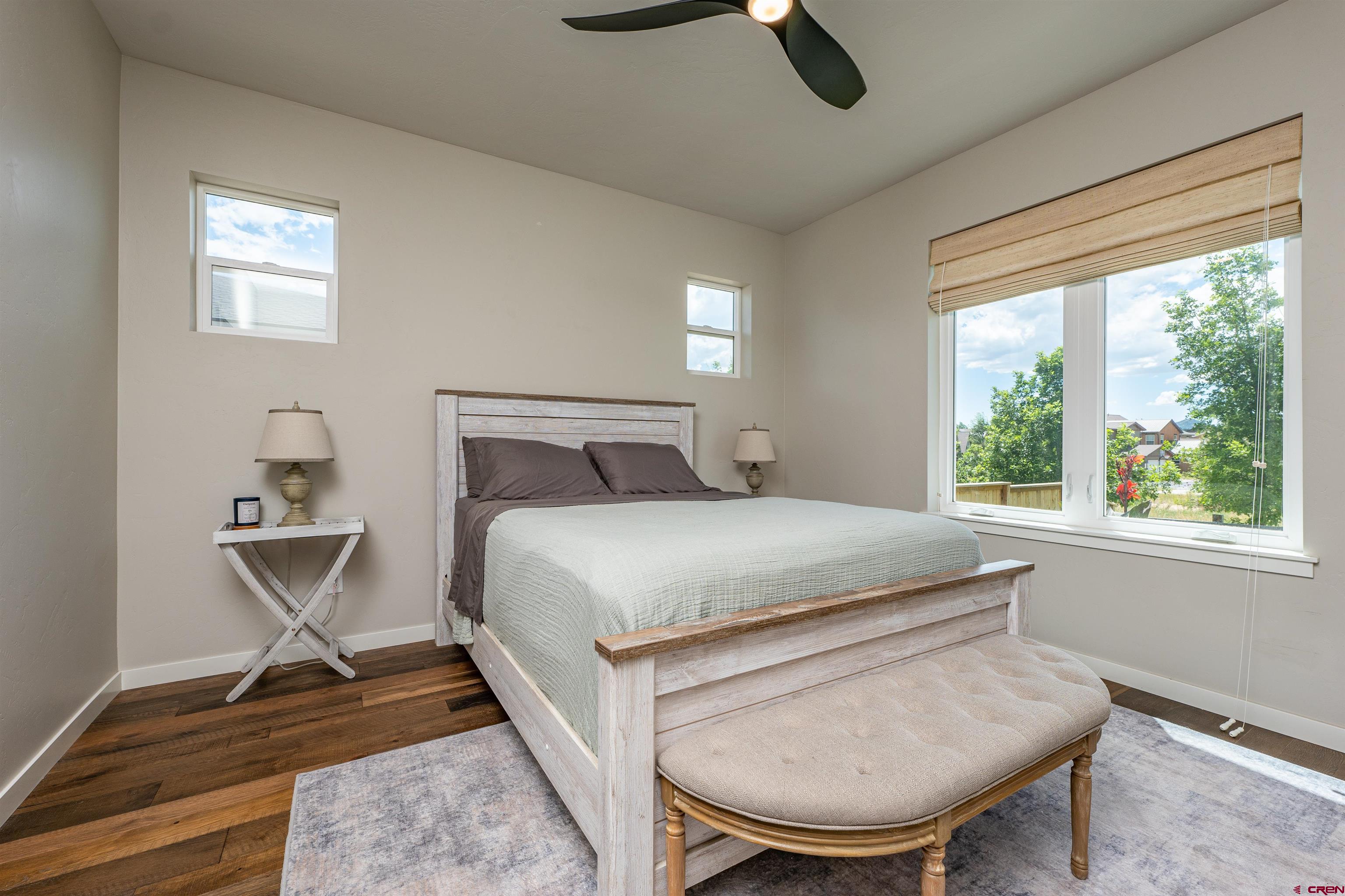 74 Prospector Avenue Durango, CO 81301 - Photo 11 of 30 a bedroom with a bed window and chair