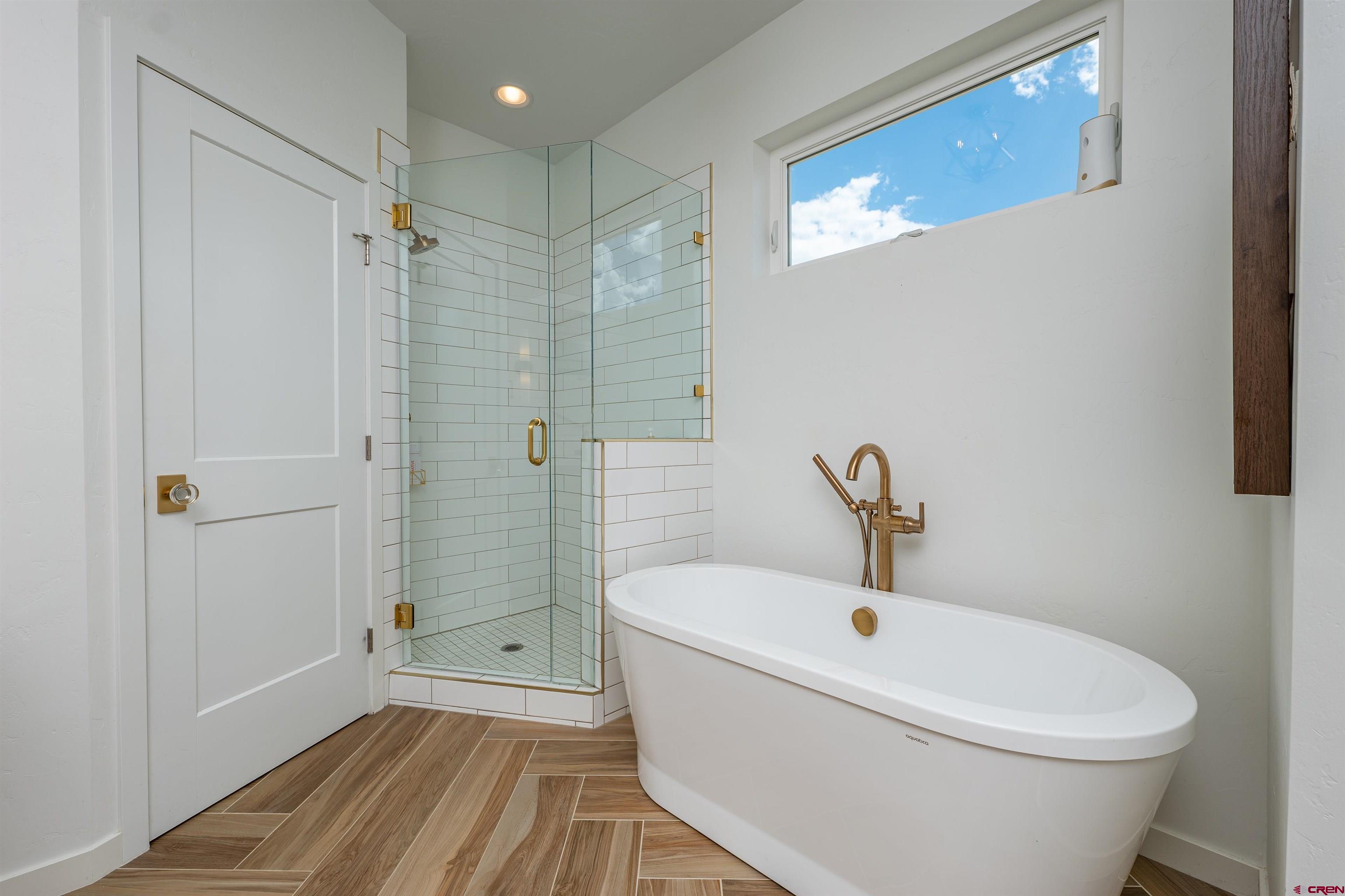 74 Prospector Avenue Durango, CO 81301 - Photo 13 of 30 a bathroom with a toilet a sink and shower