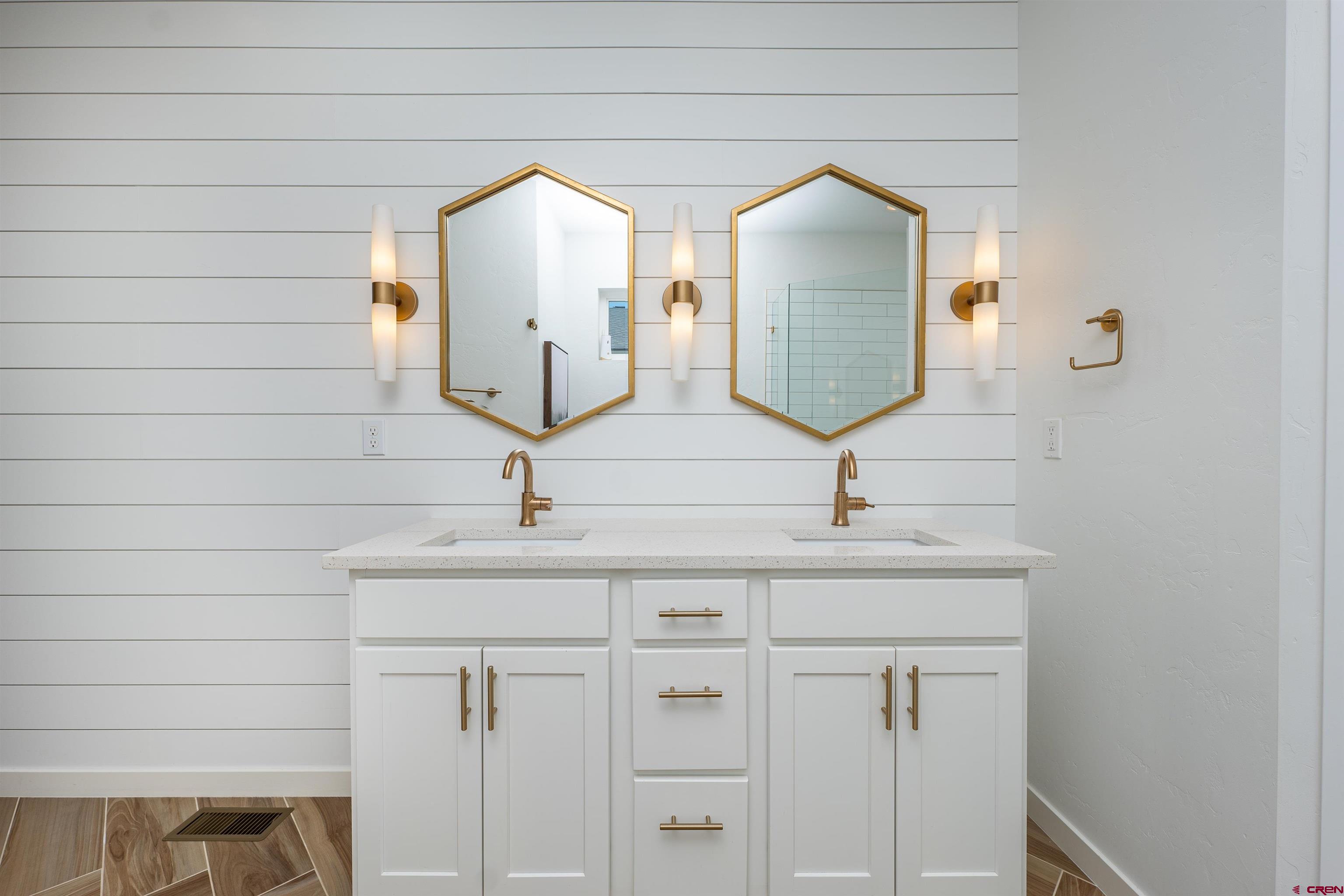 74 Prospector Avenue Durango, CO 81301 - Photo 14 of 30 a bathroom with a sink and mirror
