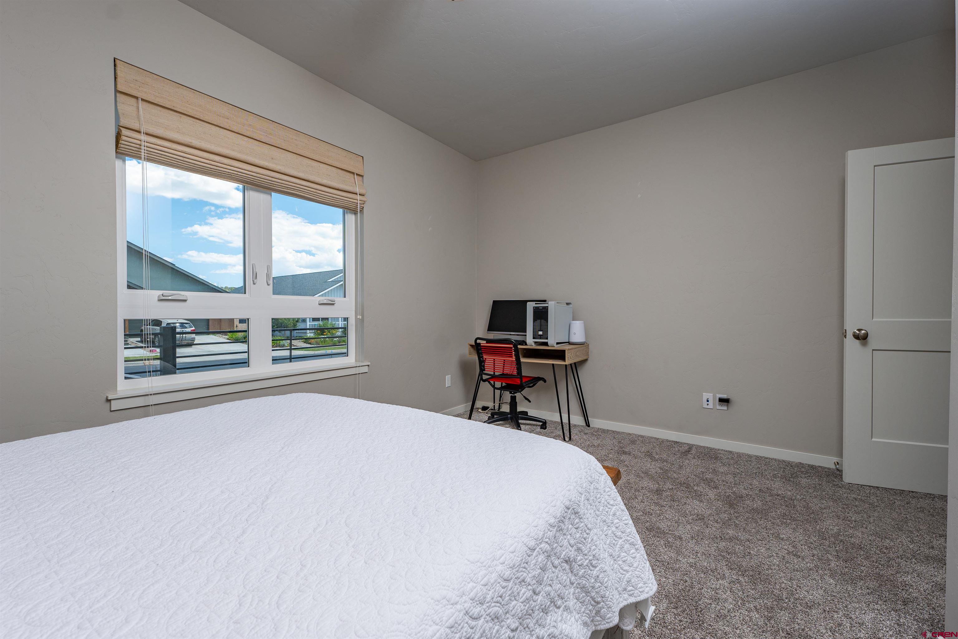 74 Prospector Avenue Durango, CO 81301 - Photo 17 of 30 a bedroom with a bed and a window