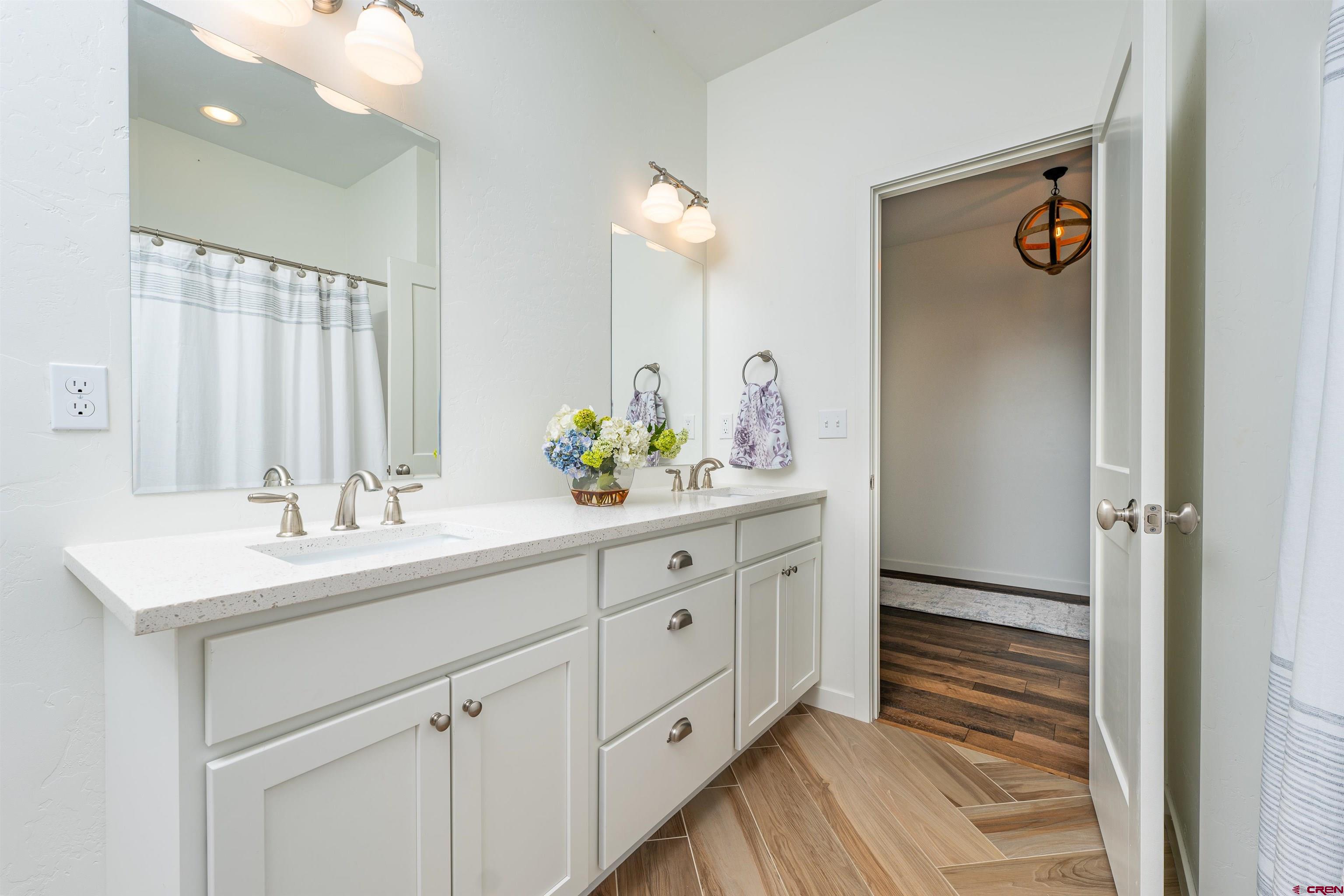 74 Prospector Avenue Durango, CO 81301 - Photo 20 of 30 a bathroom with a sink double vanity and a mirror