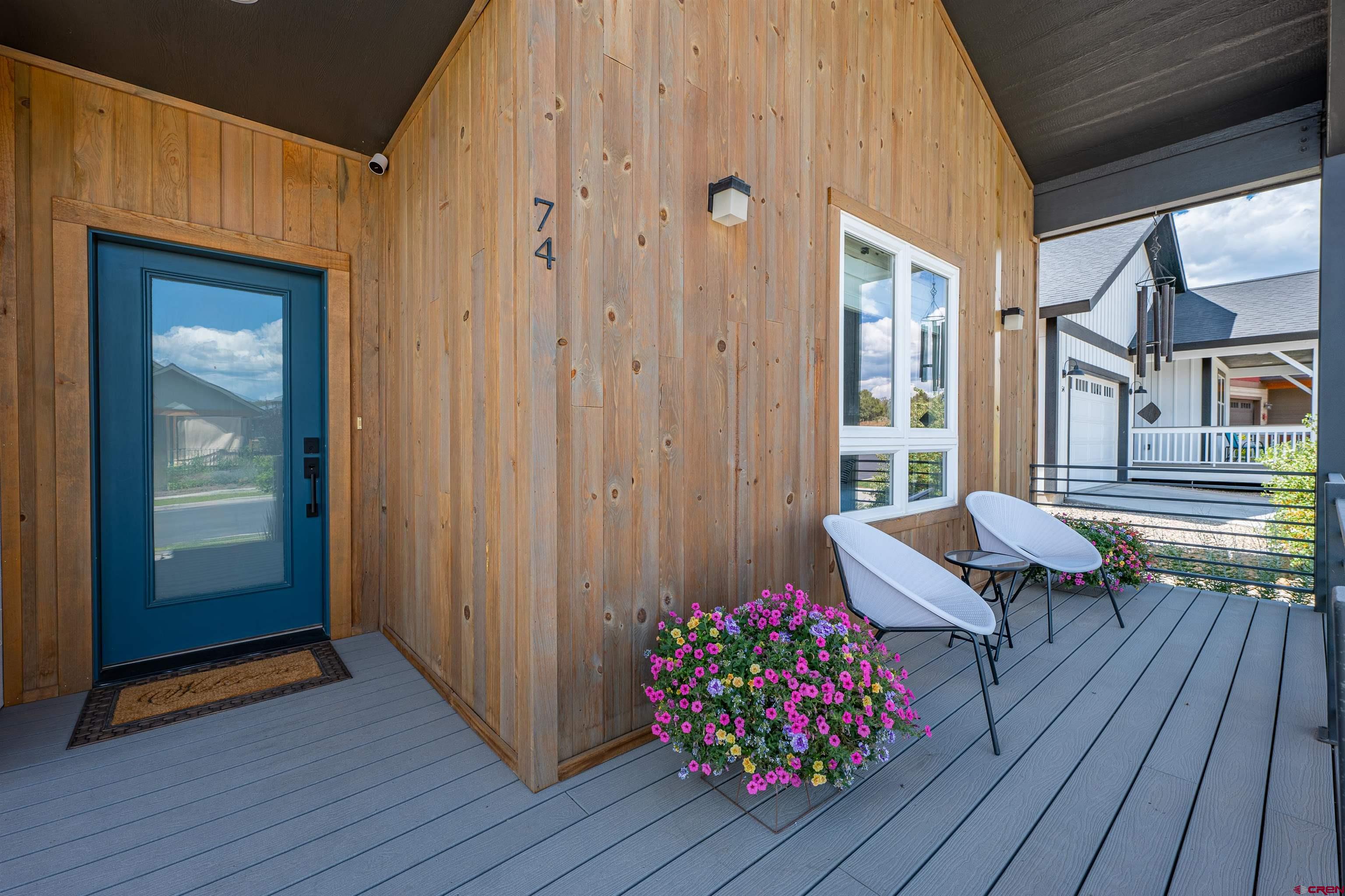 74 Prospector Avenue Durango, CO 81301 - Photo 2 of 30 a balcony with couch and wooden floor