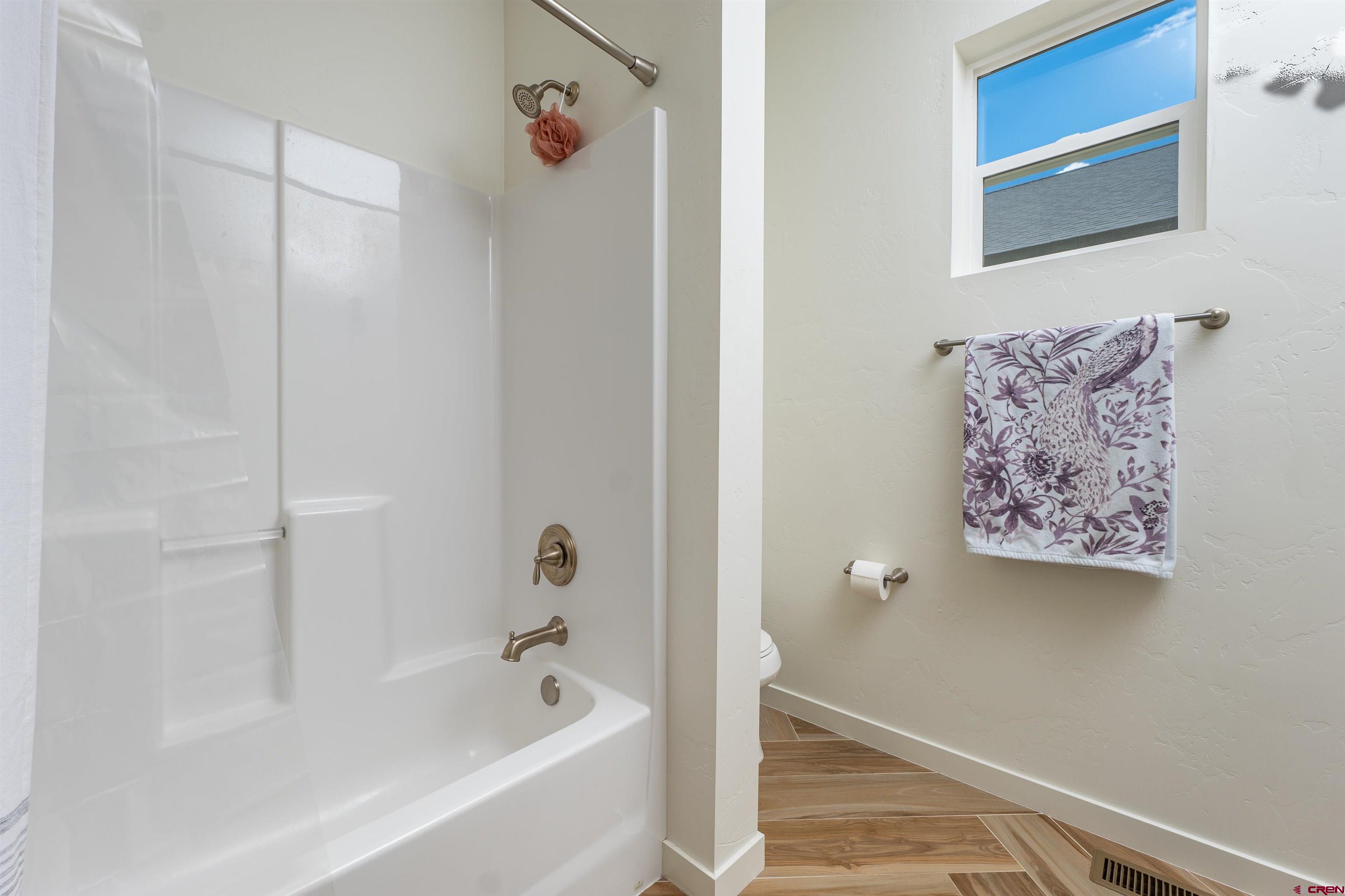 74 Prospector Avenue Durango, CO 81301 - Photo 21 of 30 a bathroom with a bathtub and shower