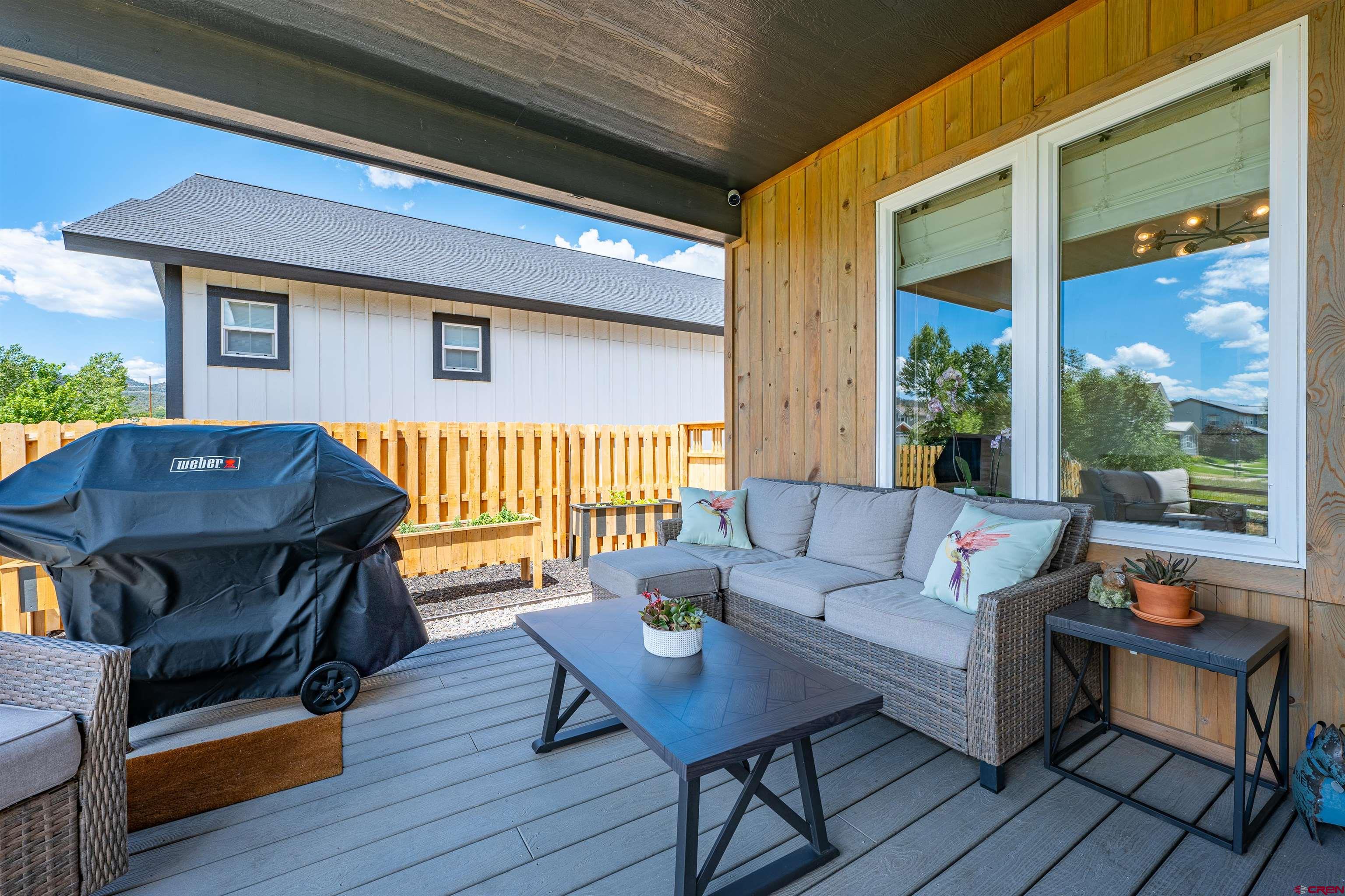 74 Prospector Avenue Durango, CO 81301 - Photo 26 of 30 a living room with furniture and a wooden floor