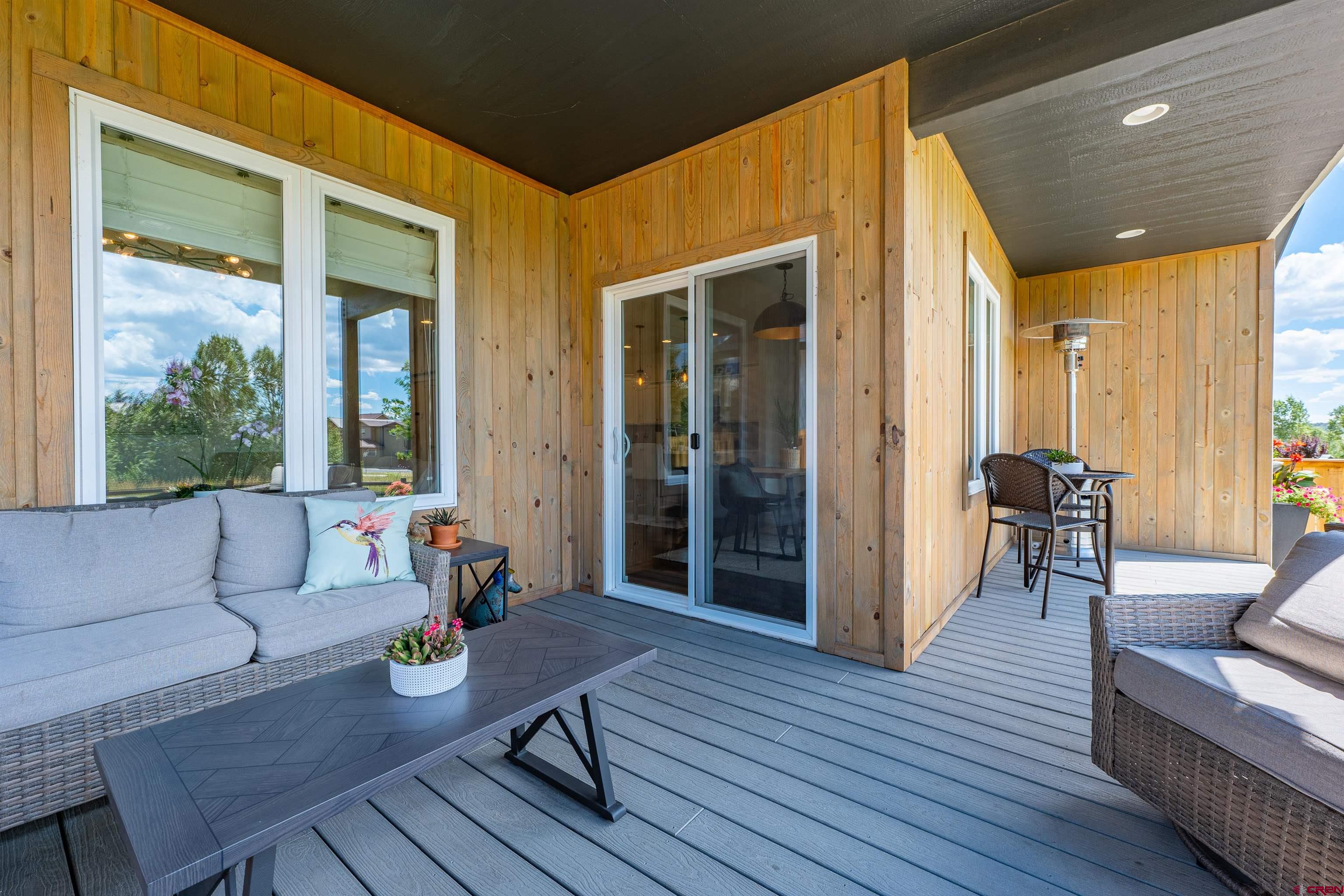 74 Prospector Avenue Durango, CO 81301 - Photo 27 of 30 a outdoor space with patio the couches and a dining table with wooden floor