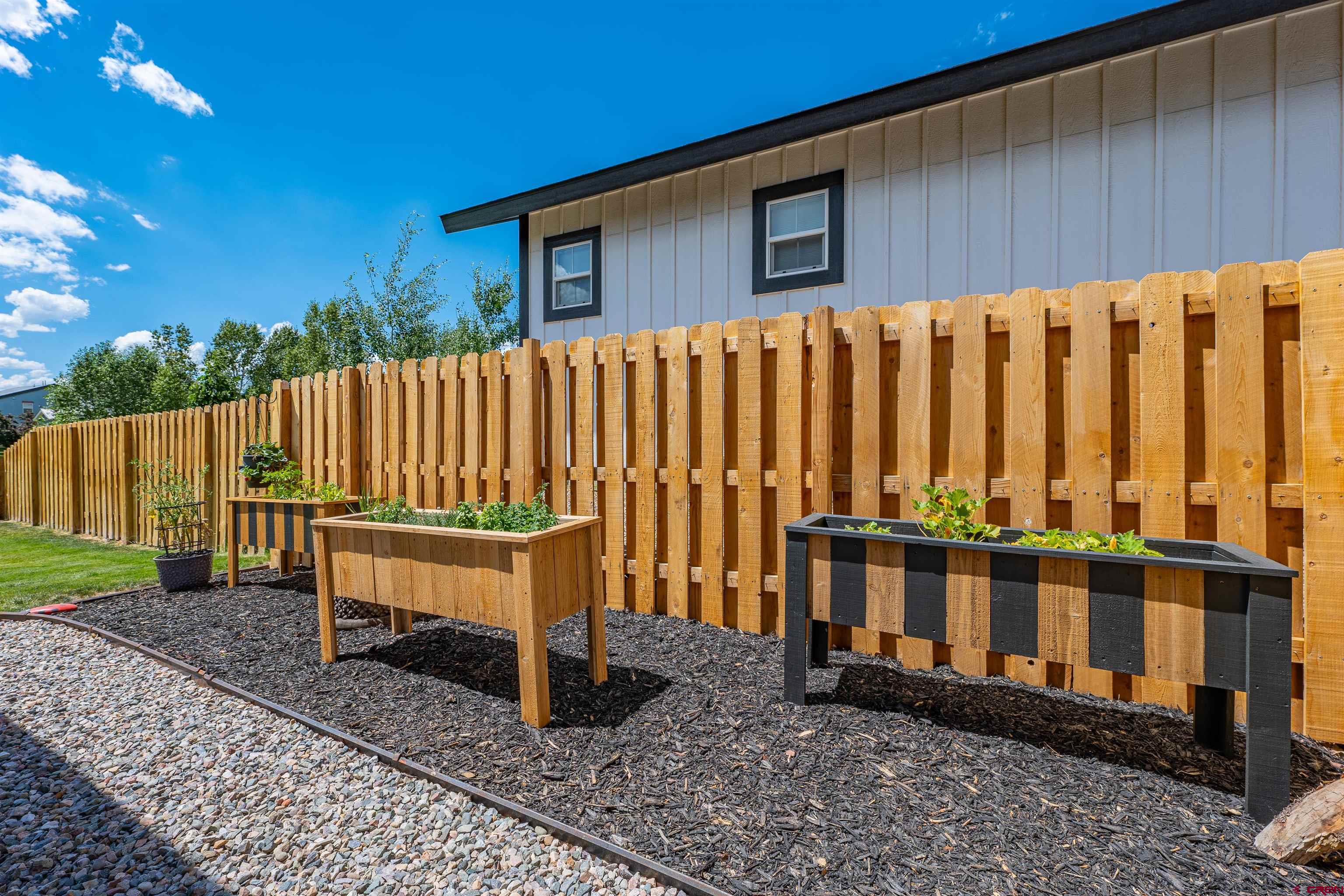 74 Prospector Avenue Durango, CO 81301 - Photo 28 of 30 a view of a wooden bench in a backyard