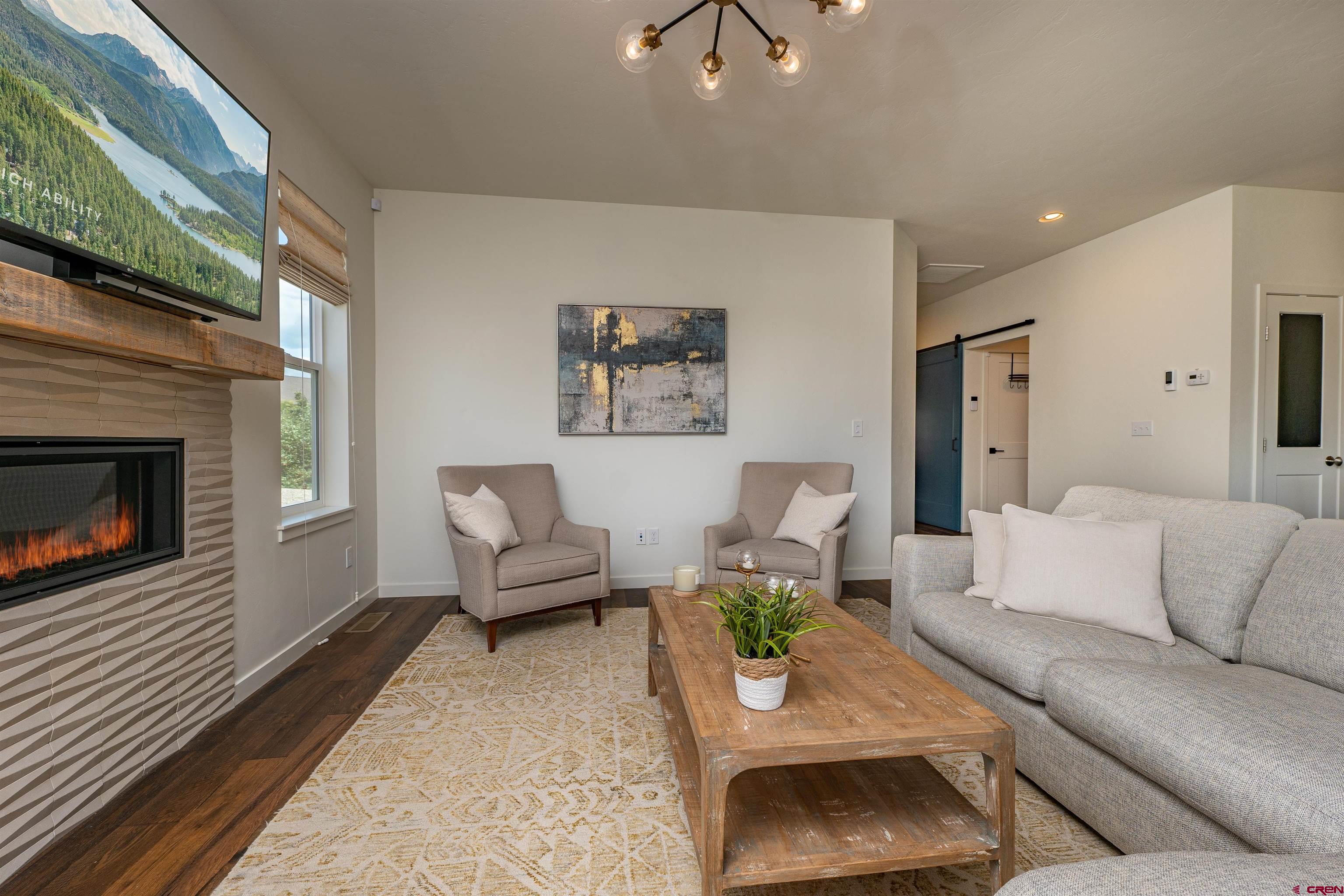 74 Prospector Avenue Durango, CO 81301 - Photo 4 of 30 a living room with furniture and a fireplace