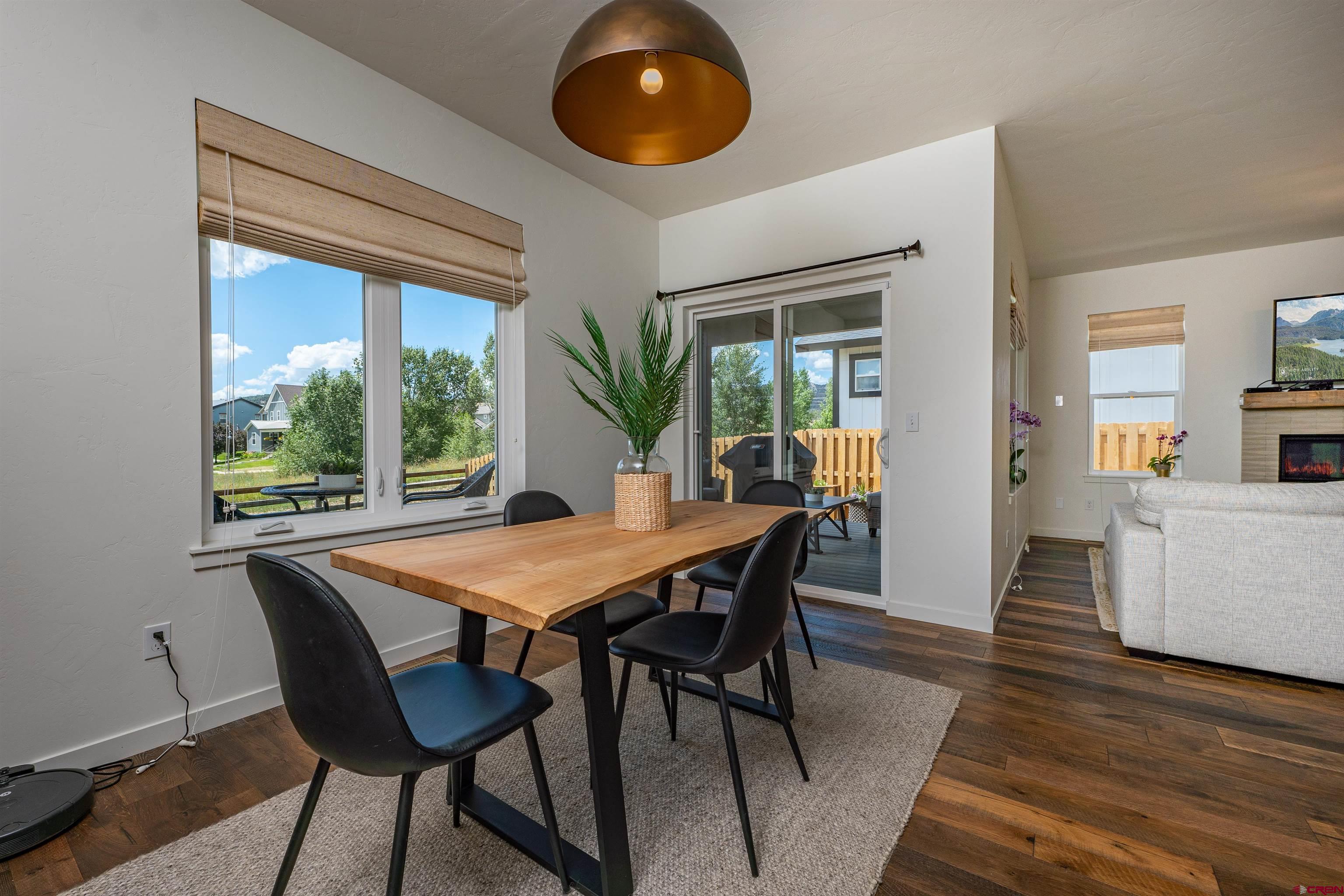 74 Prospector Avenue Durango, CO 81301 - Photo 9 of 30 a view of a dining room with furniture and wooden floor