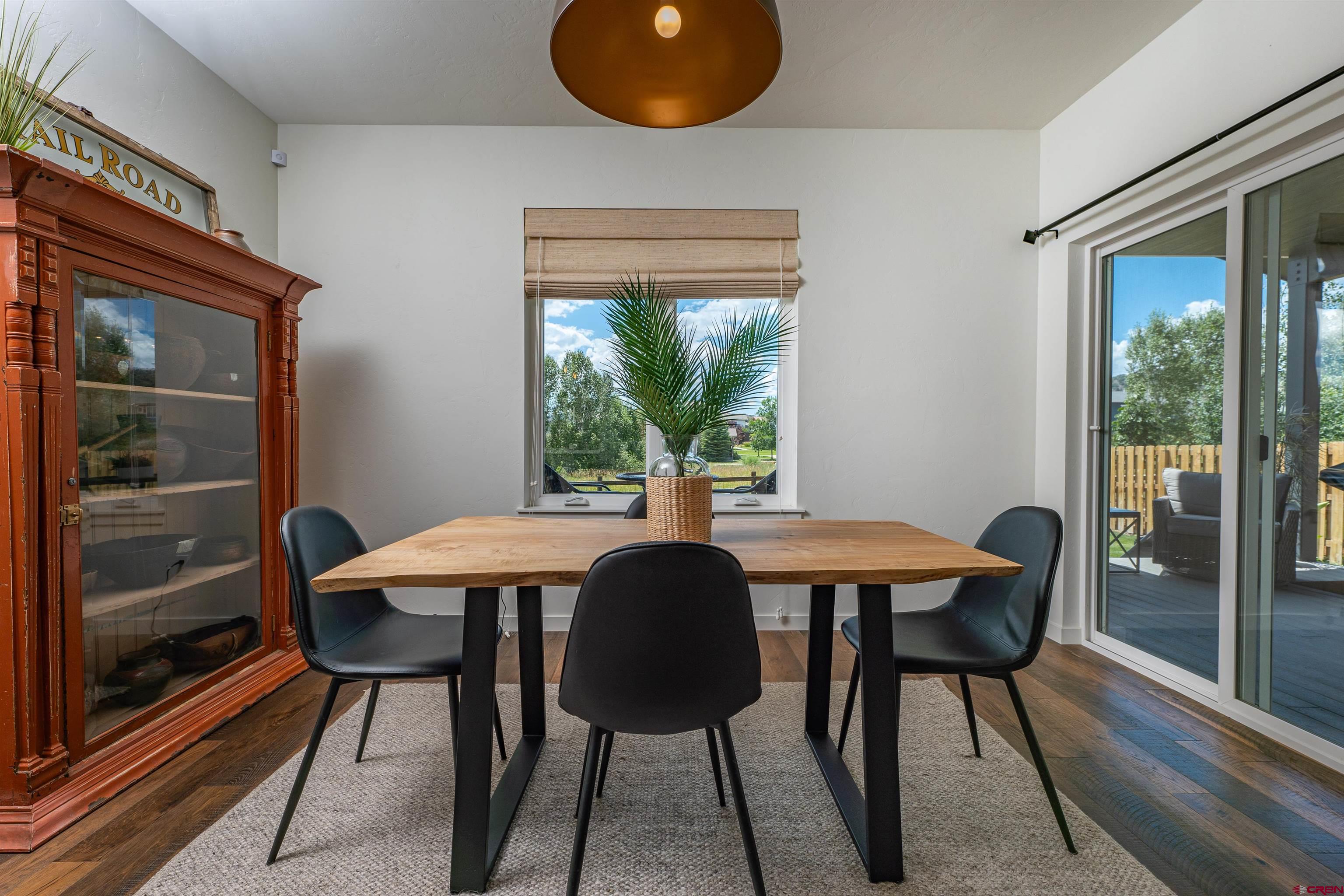 74 Prospector Avenue Durango, CO 81301 - Photo 10 of 30 a view of a dining room with furniture and window