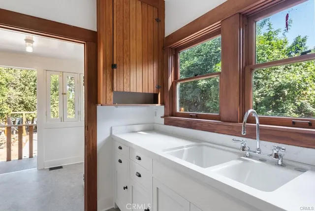 a room with a window and cabinets