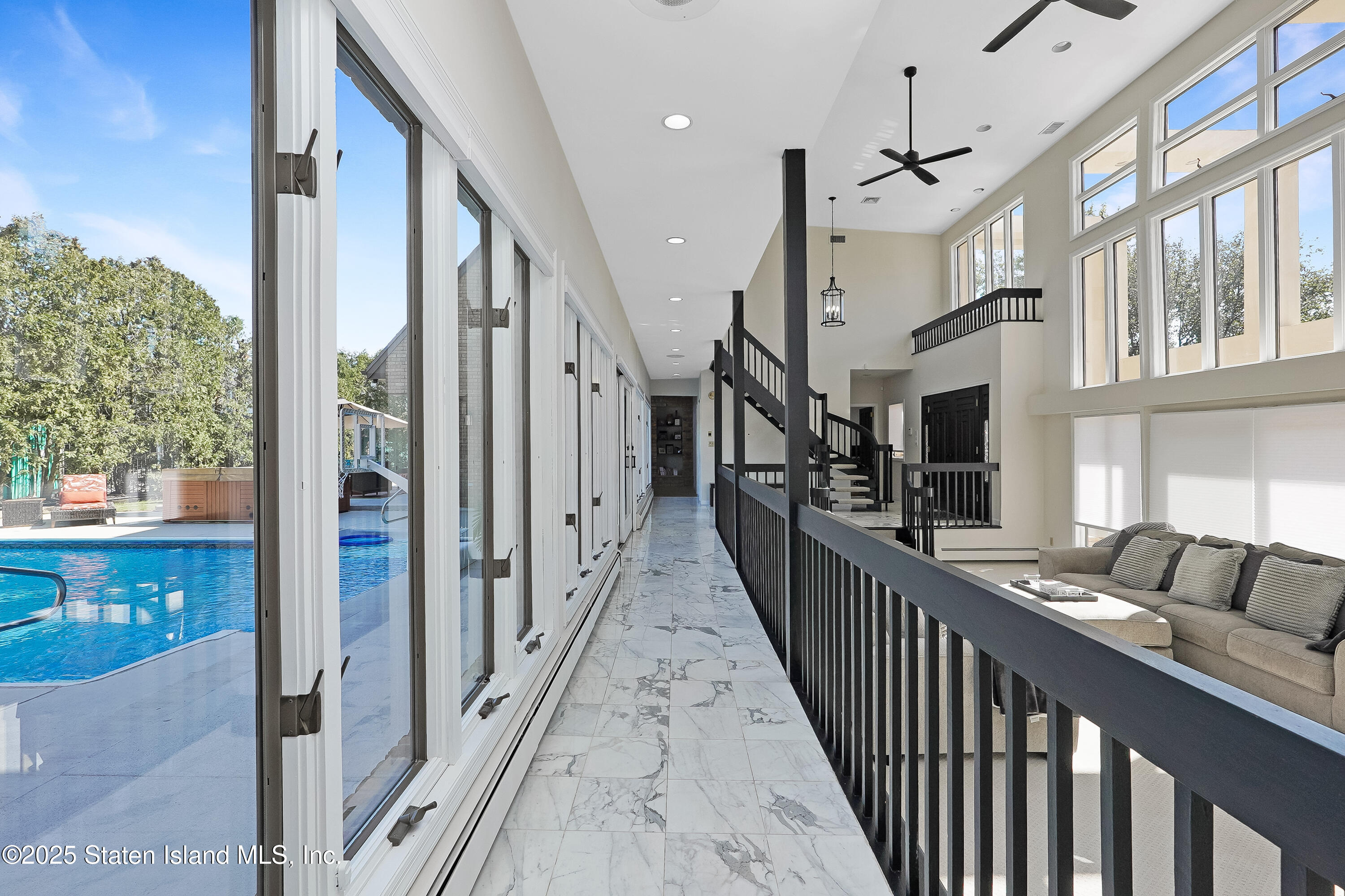 Undisclosed Address Staten Island, NY 10307 - Photo 12 of 72 a view of a hallway with wooden floor and staircase