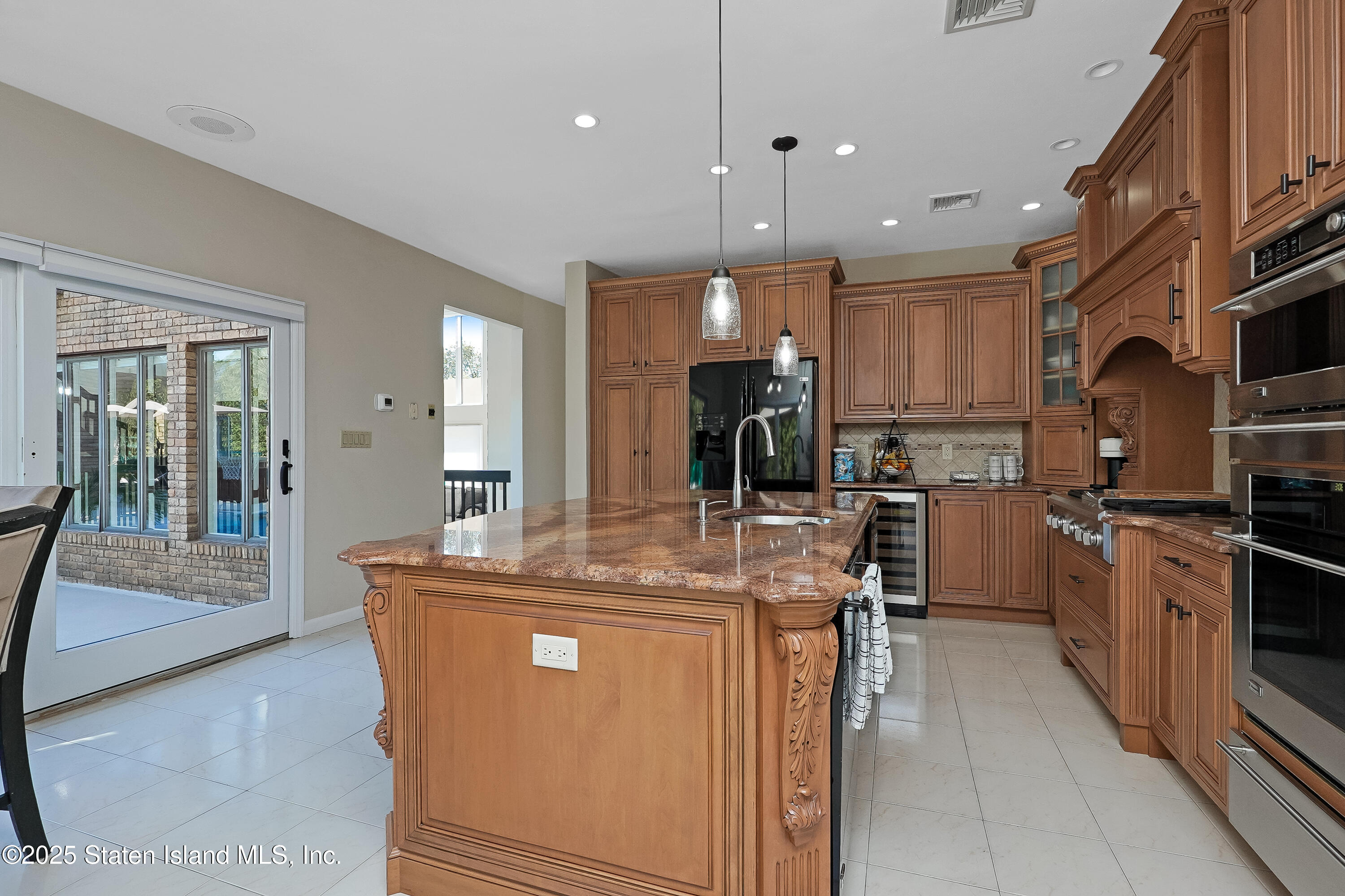 Undisclosed Address Staten Island, NY 10307 - Photo 16 of 72 a kitchen with kitchen island a counter top space a sink stainless steel appliances and cabinets