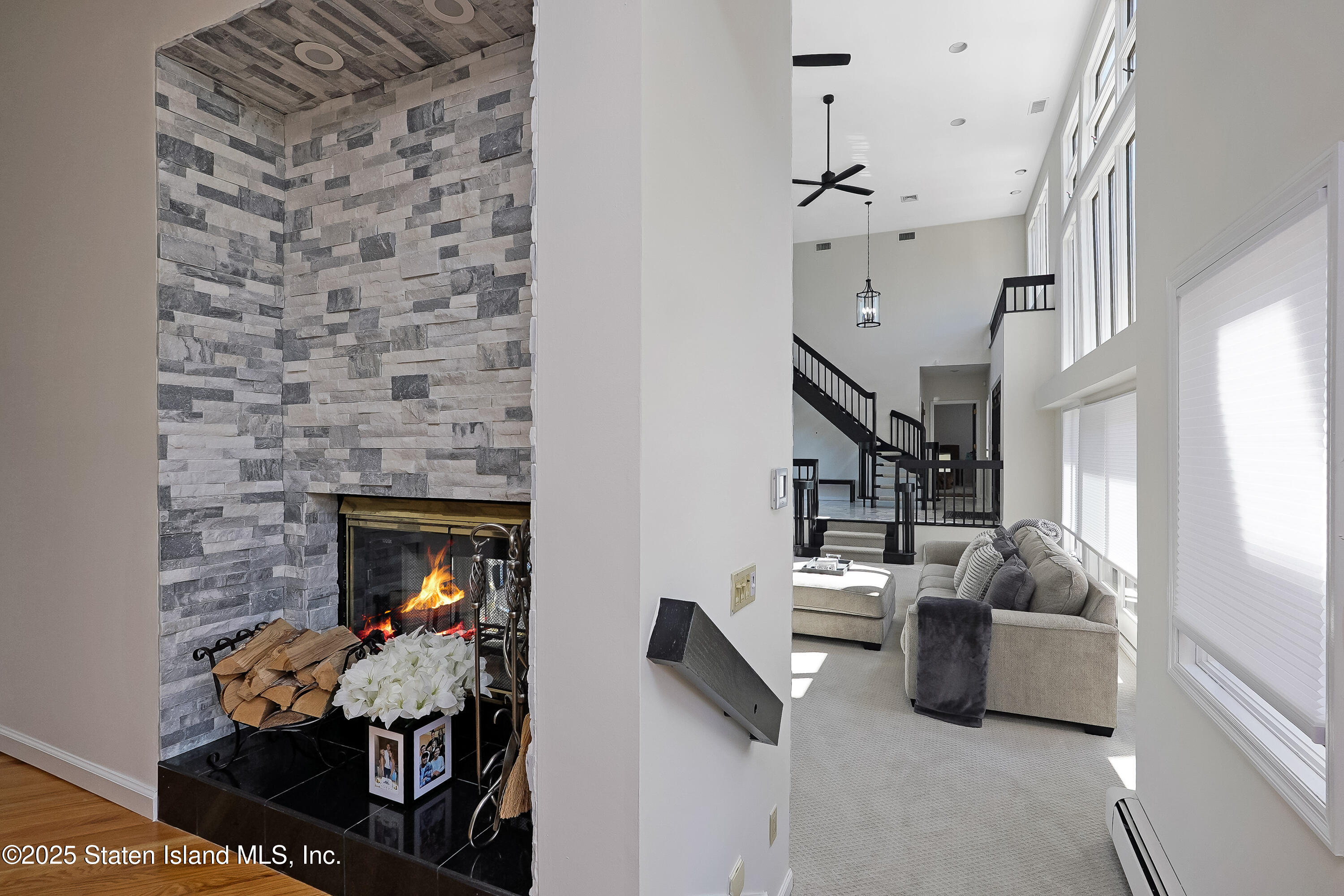 Undisclosed Address Staten Island, NY 10307 - Photo 23 of 72 a living room with furniture and a fireplace