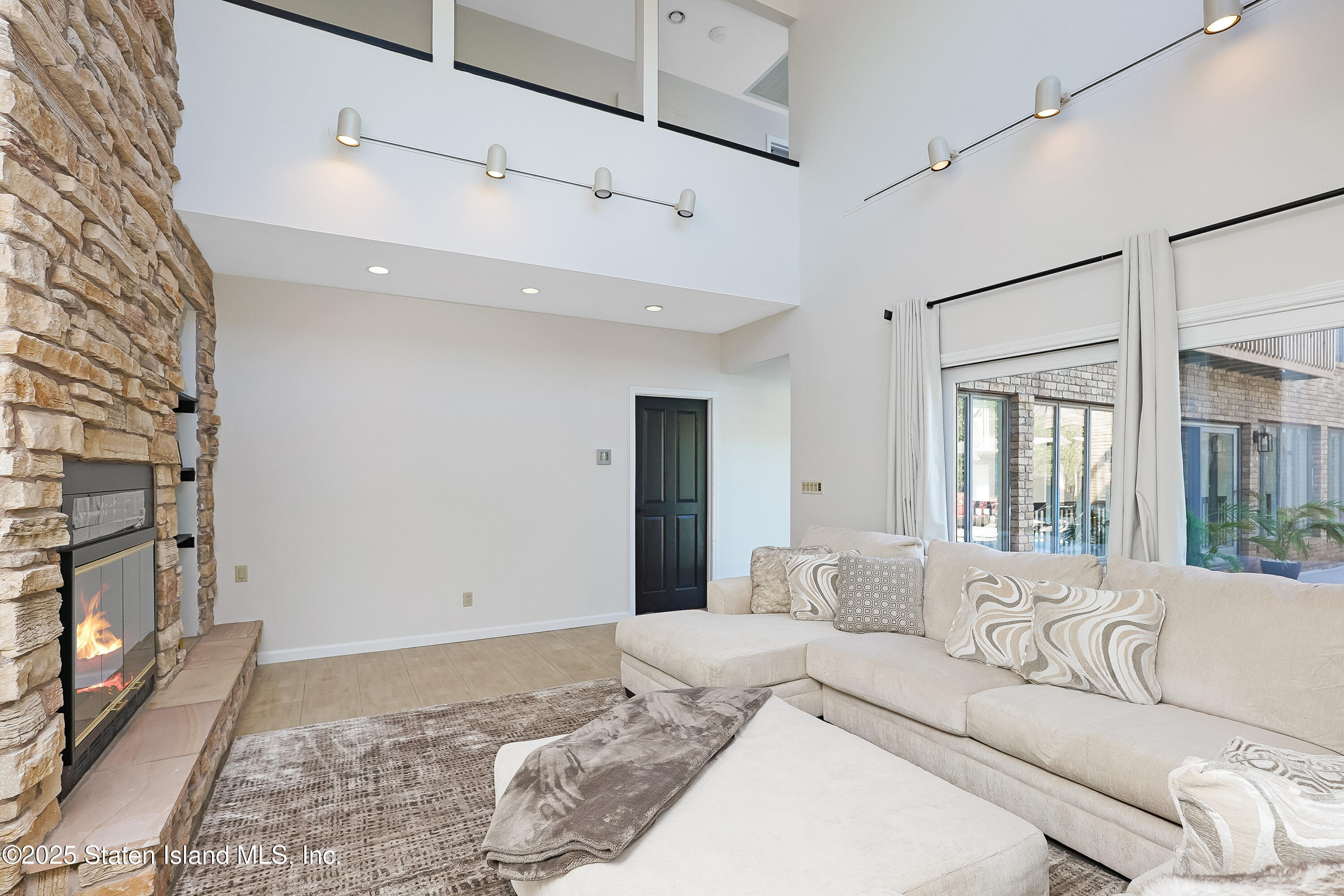 Undisclosed Address Staten Island, NY 10307 - Photo 26 of 72 a bedroom with a large bed and a couch