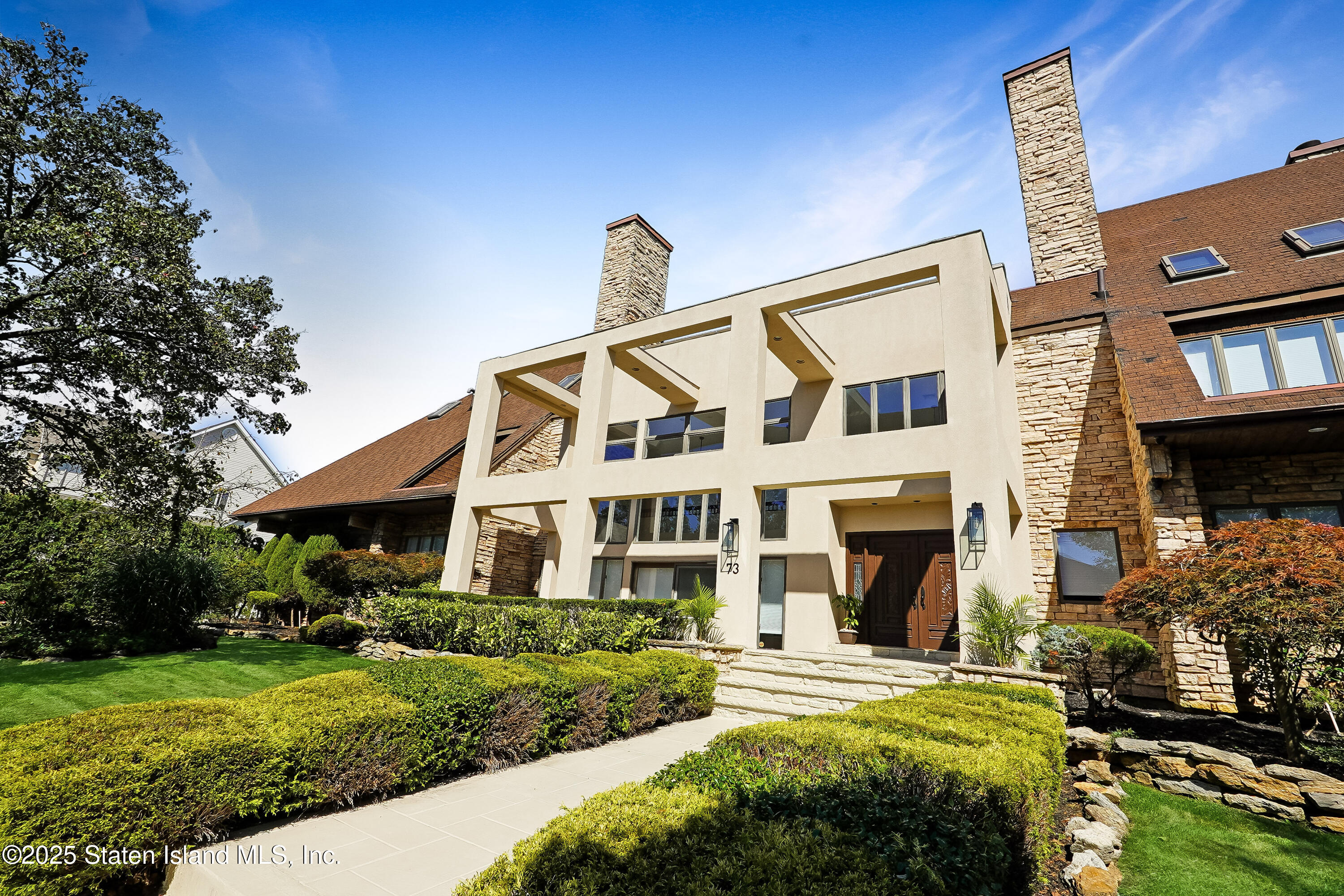 Undisclosed Address Staten Island, NY 10307 - Photo 3 of 72 a front view of a house with a yard