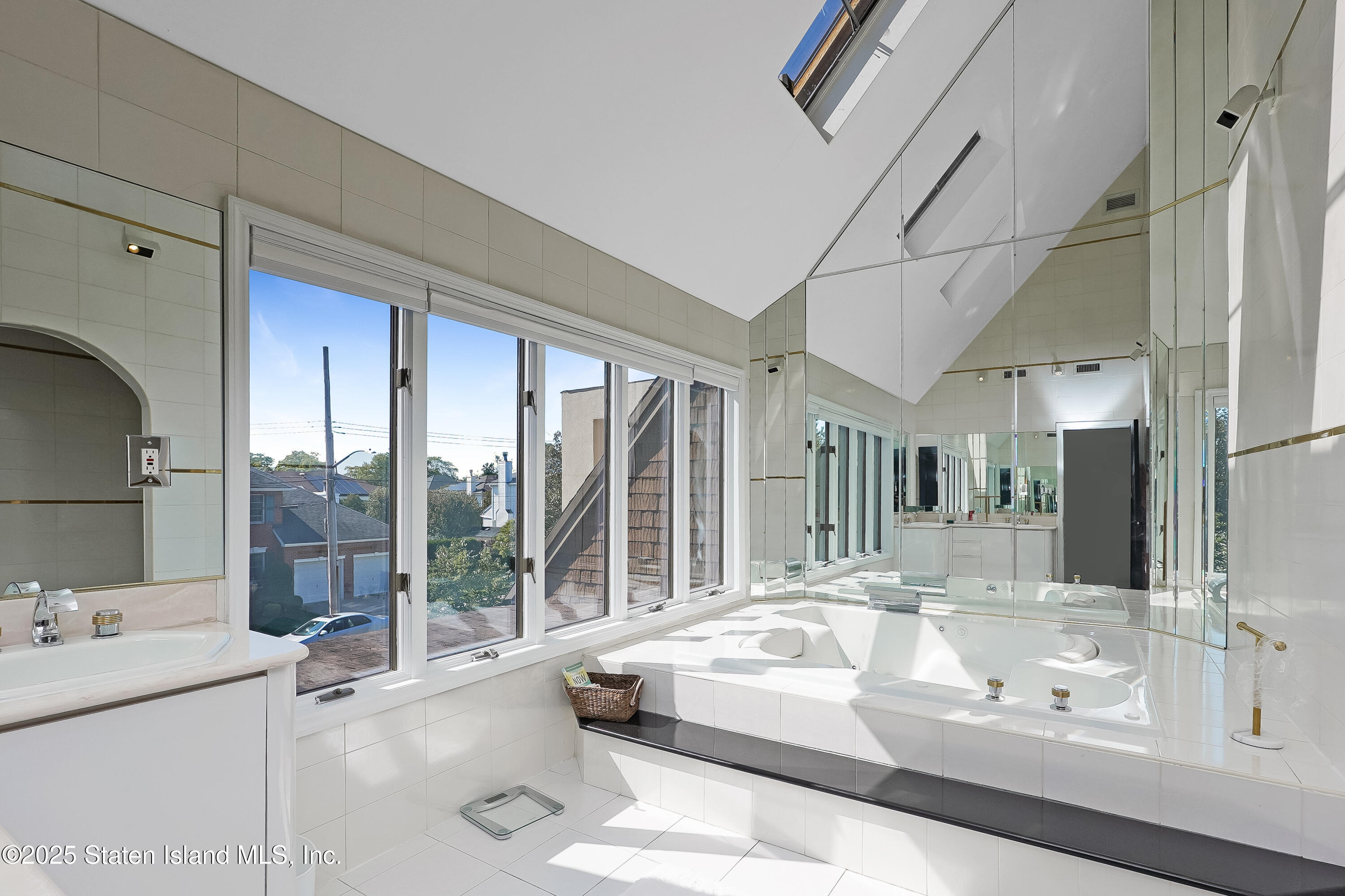 Undisclosed Address Staten Island, NY 10307 - Photo 37 of 72 a spacious bathroom with a tub sink and mirror
