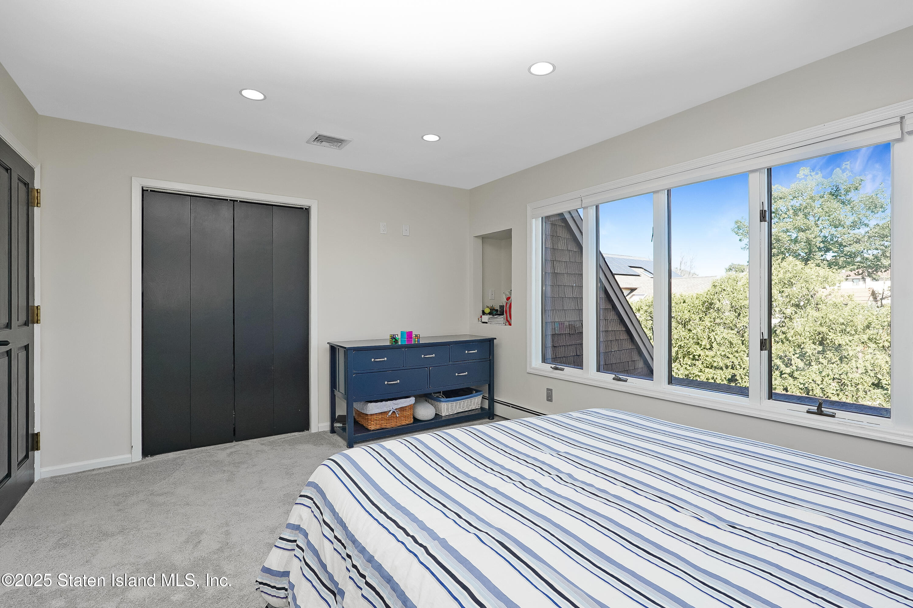 Undisclosed Address Staten Island, NY 10307 - Photo 39 of 72 a bedroom with furniture and a window
