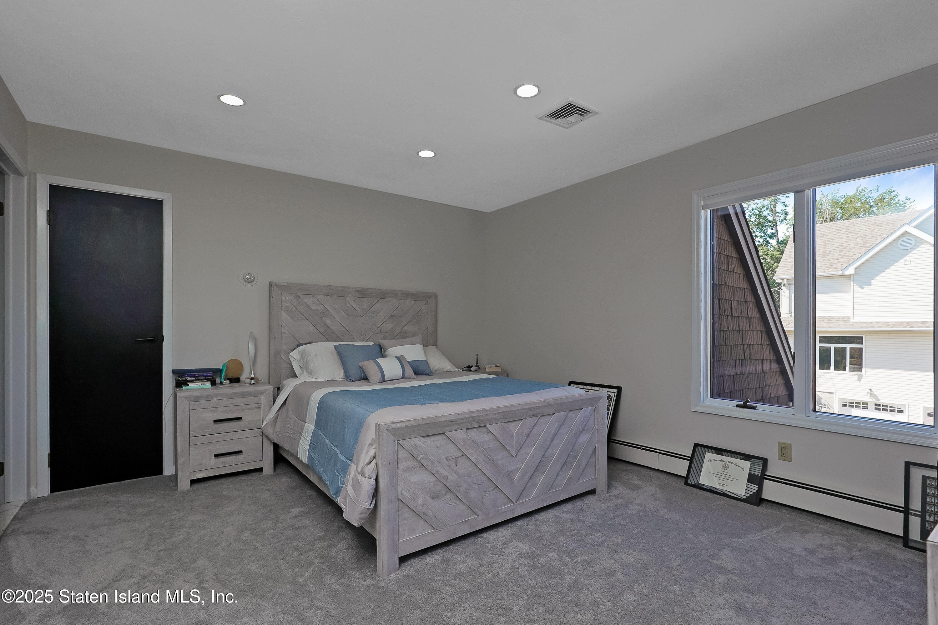 Undisclosed Address Staten Island, NY 10307 - Photo 41 of 72 a bed room with a bed and a window