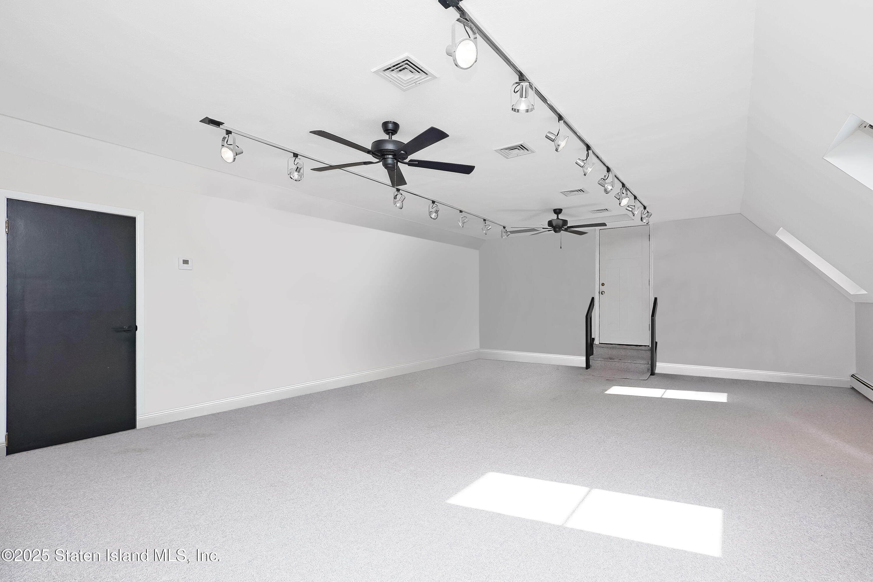 Undisclosed Address Staten Island, NY 10307 - Photo 47 of 72 a view of a big room with stairs