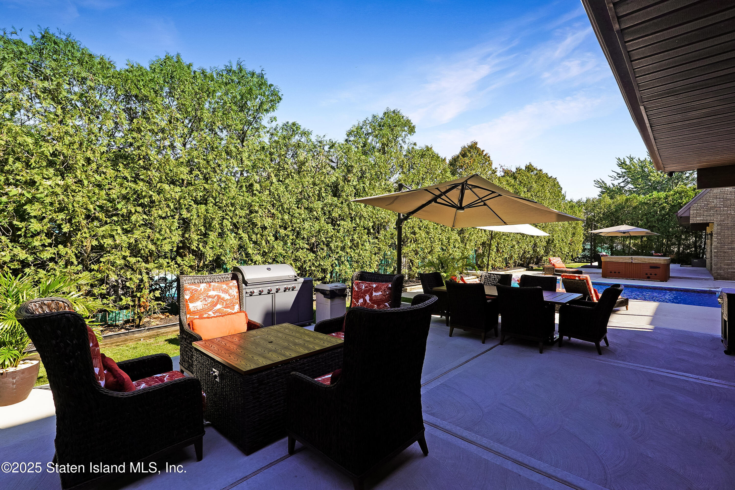 Undisclosed Address Staten Island, NY 10307 - Photo 56 of 72 a view of a patio with couches potted plants and a table and chairs