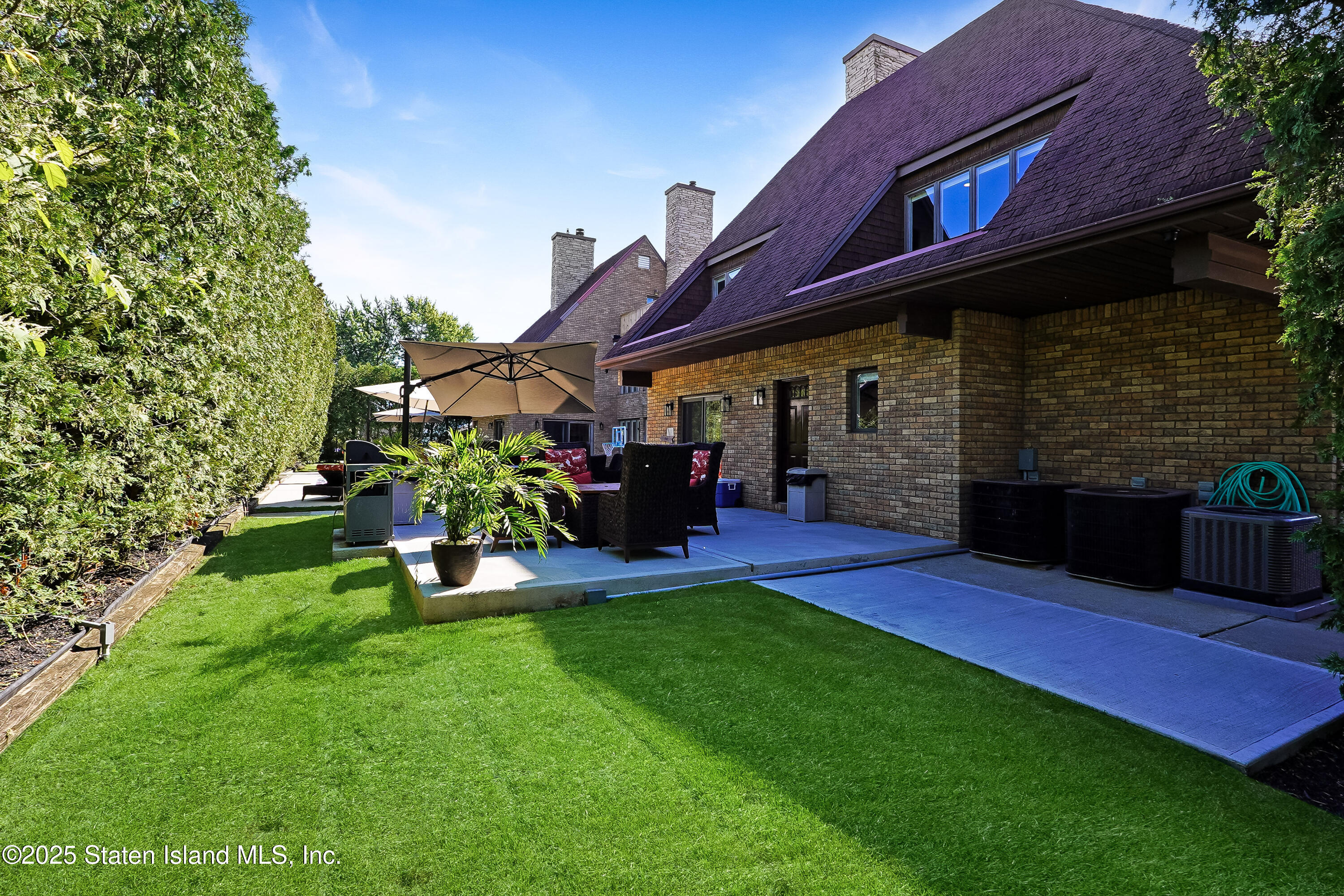 Undisclosed Address Staten Island, NY 10307 - Photo 62 of 72 a view of a house with a yard porch and sitting area