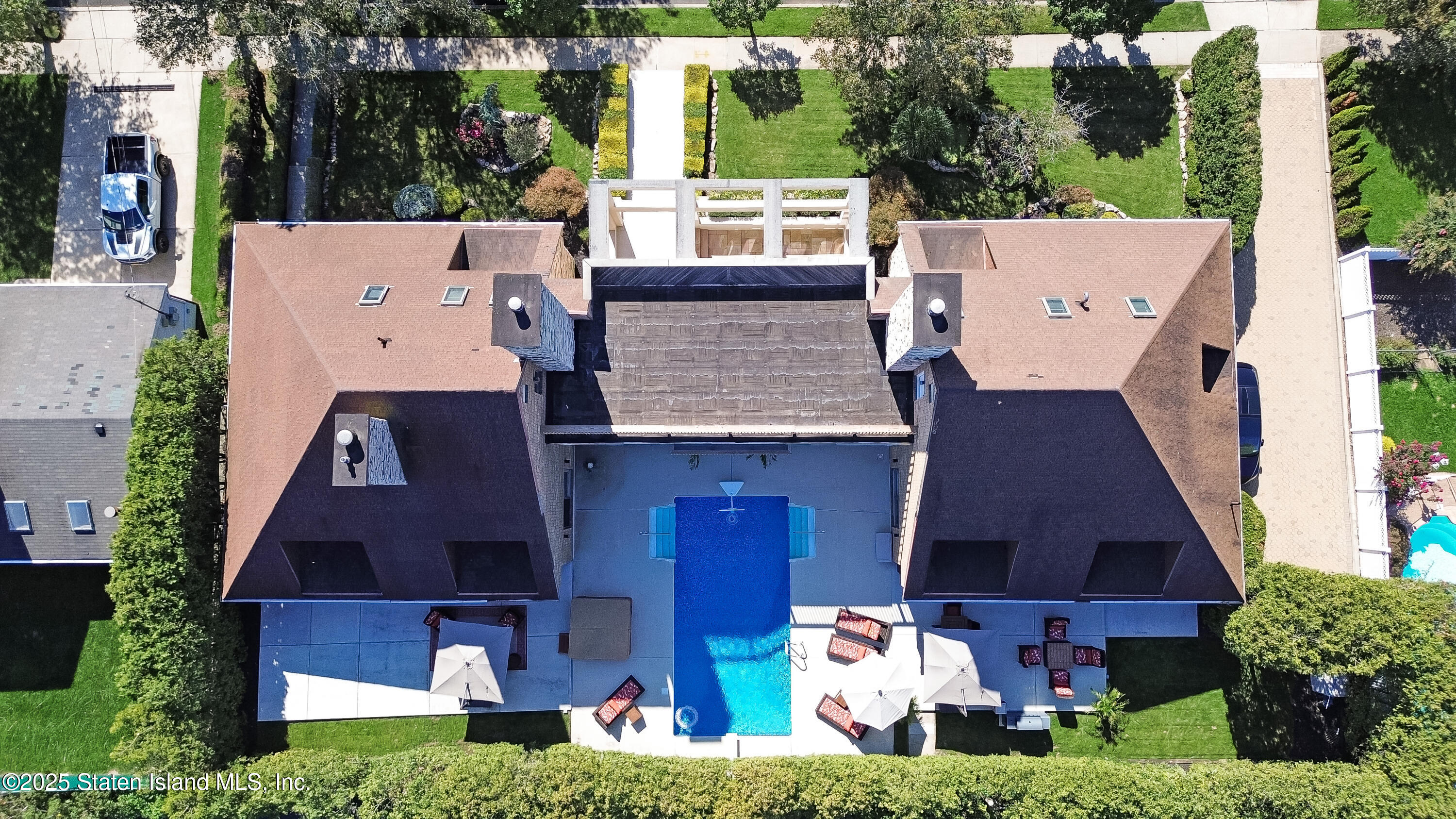 Undisclosed Address Staten Island, NY 10307 - Photo 69 of 72 aerial view of a house with a yard