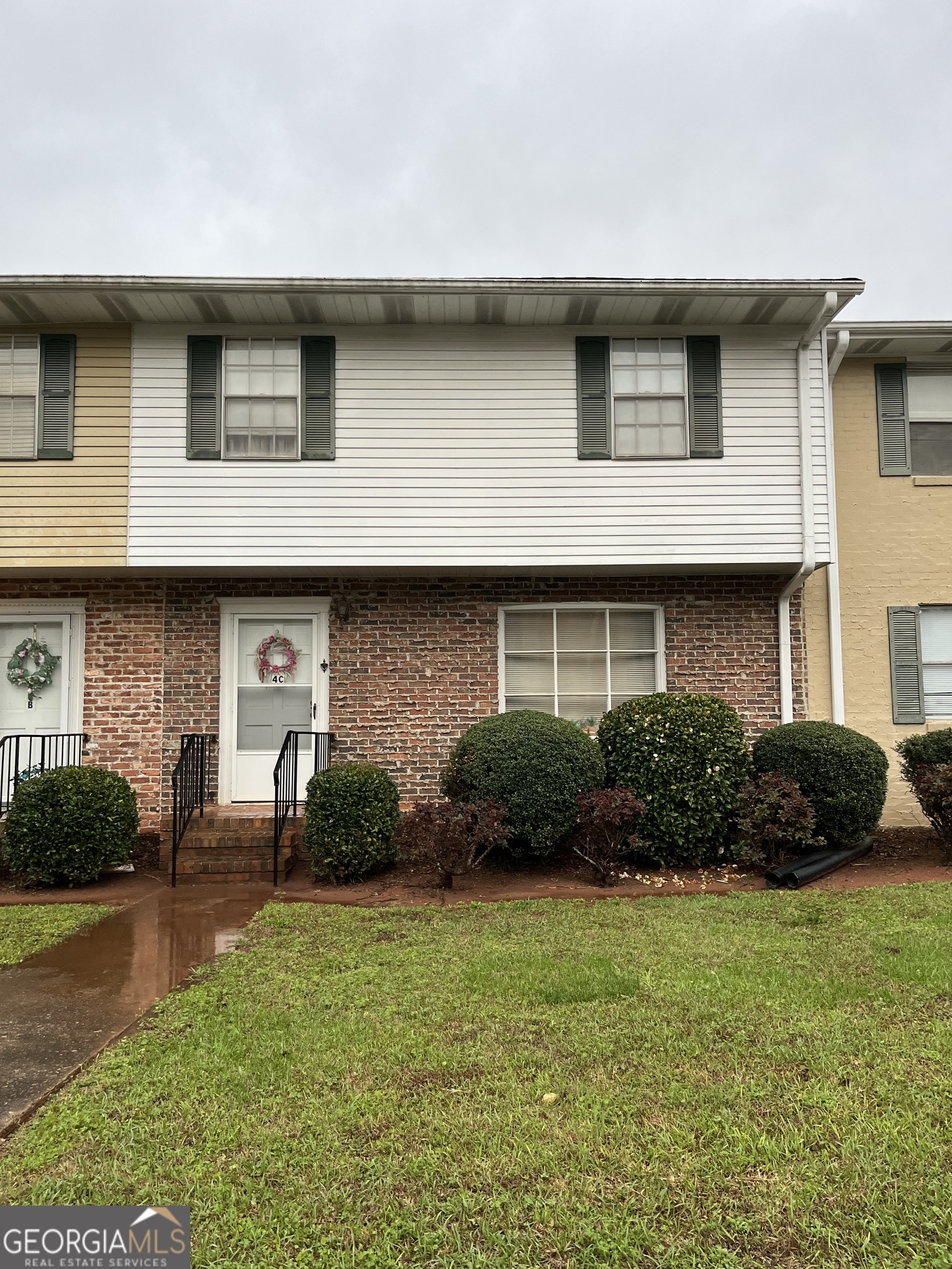 501 Carlton Road, Unit 4C Palmetto, GA 30268 - Photo 1 of 12 a front view of a house with a yard