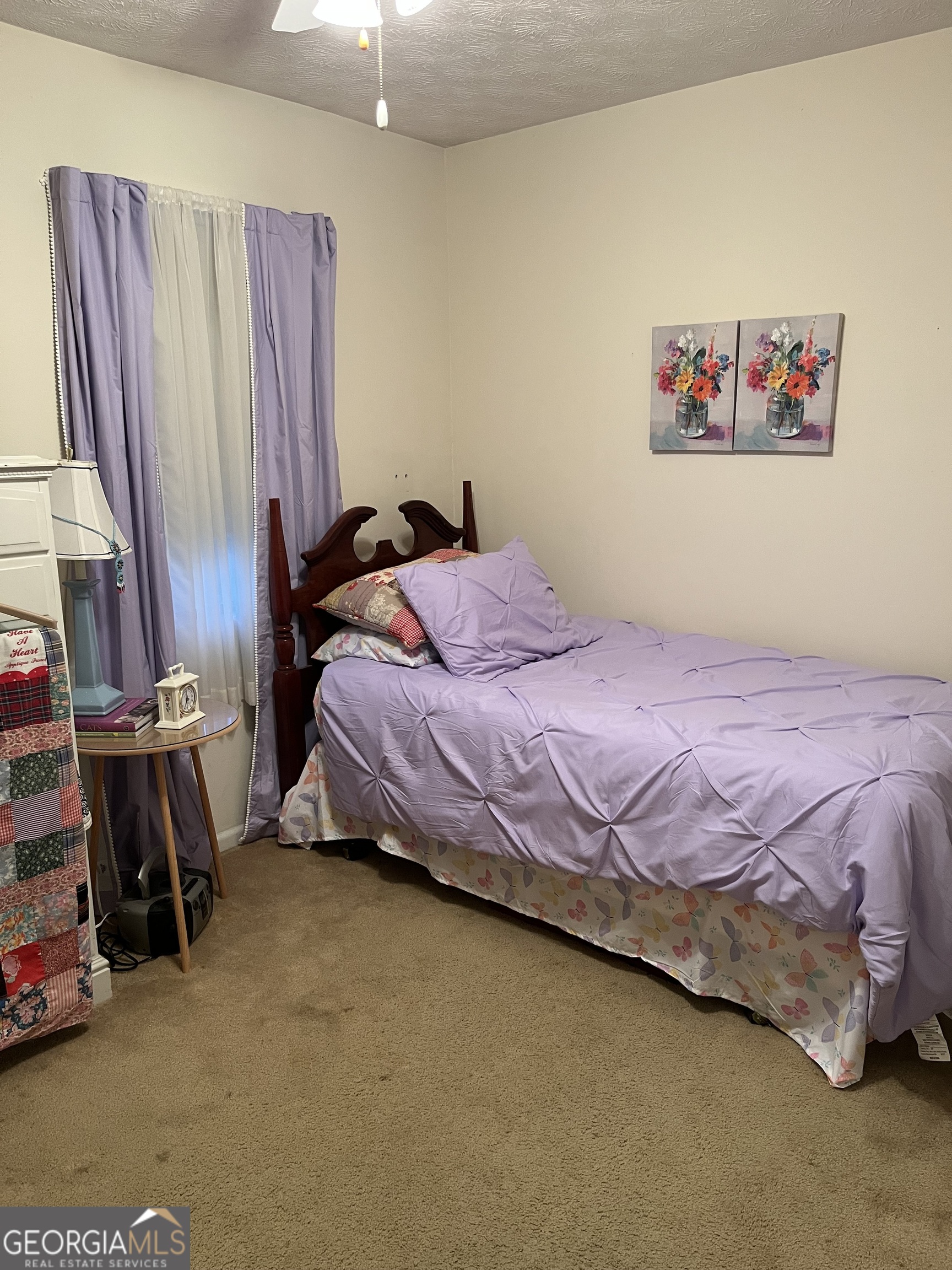 501 Carlton Road, Unit 4C Palmetto, GA 30268 - Photo 11 of 12 a bedroom with a bed and a view of kitchen