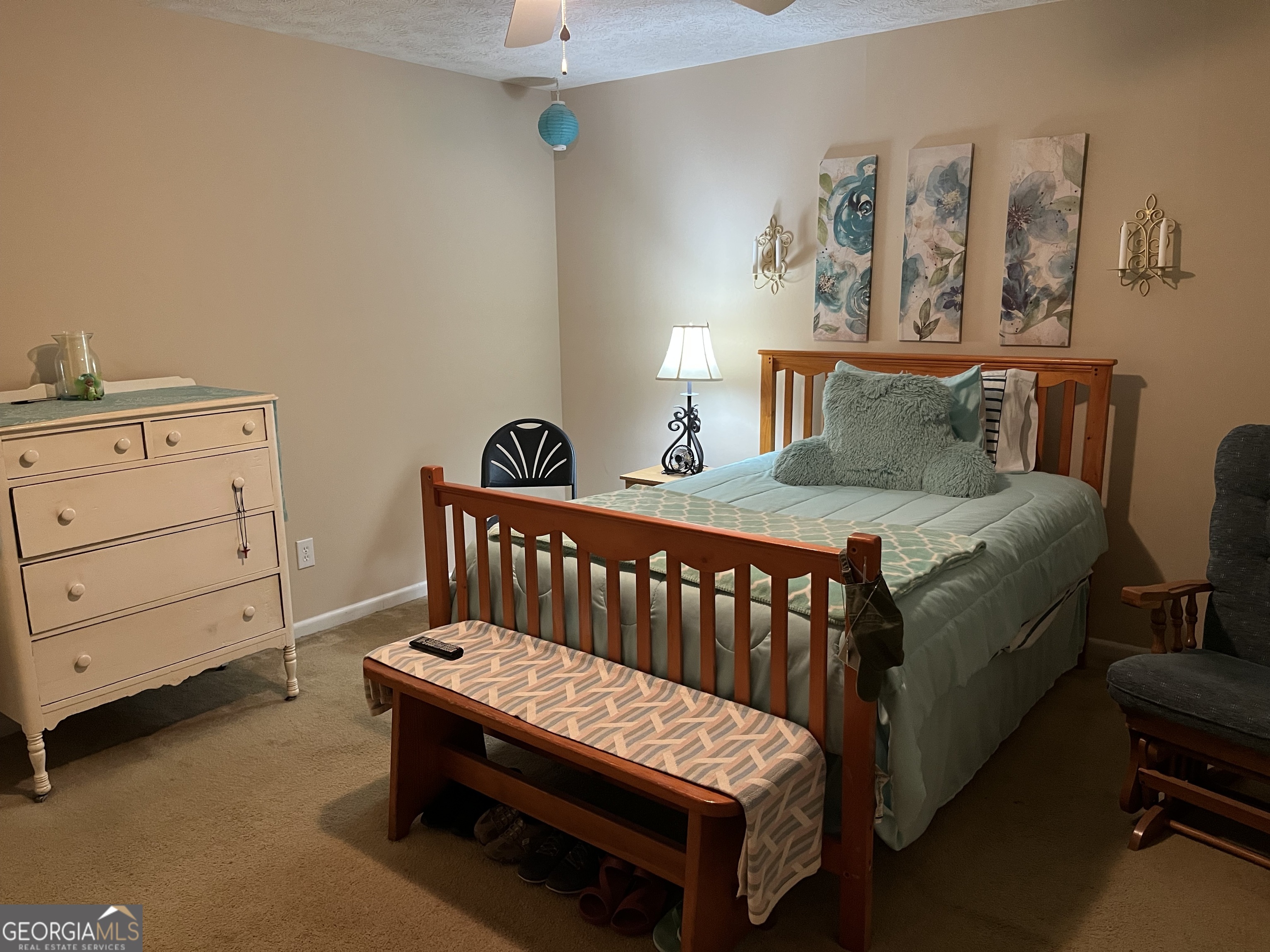 501 Carlton Road, Unit 4C Palmetto, GA 30268 - Photo 8 of 12 a bedroom with a bed and wooden floor