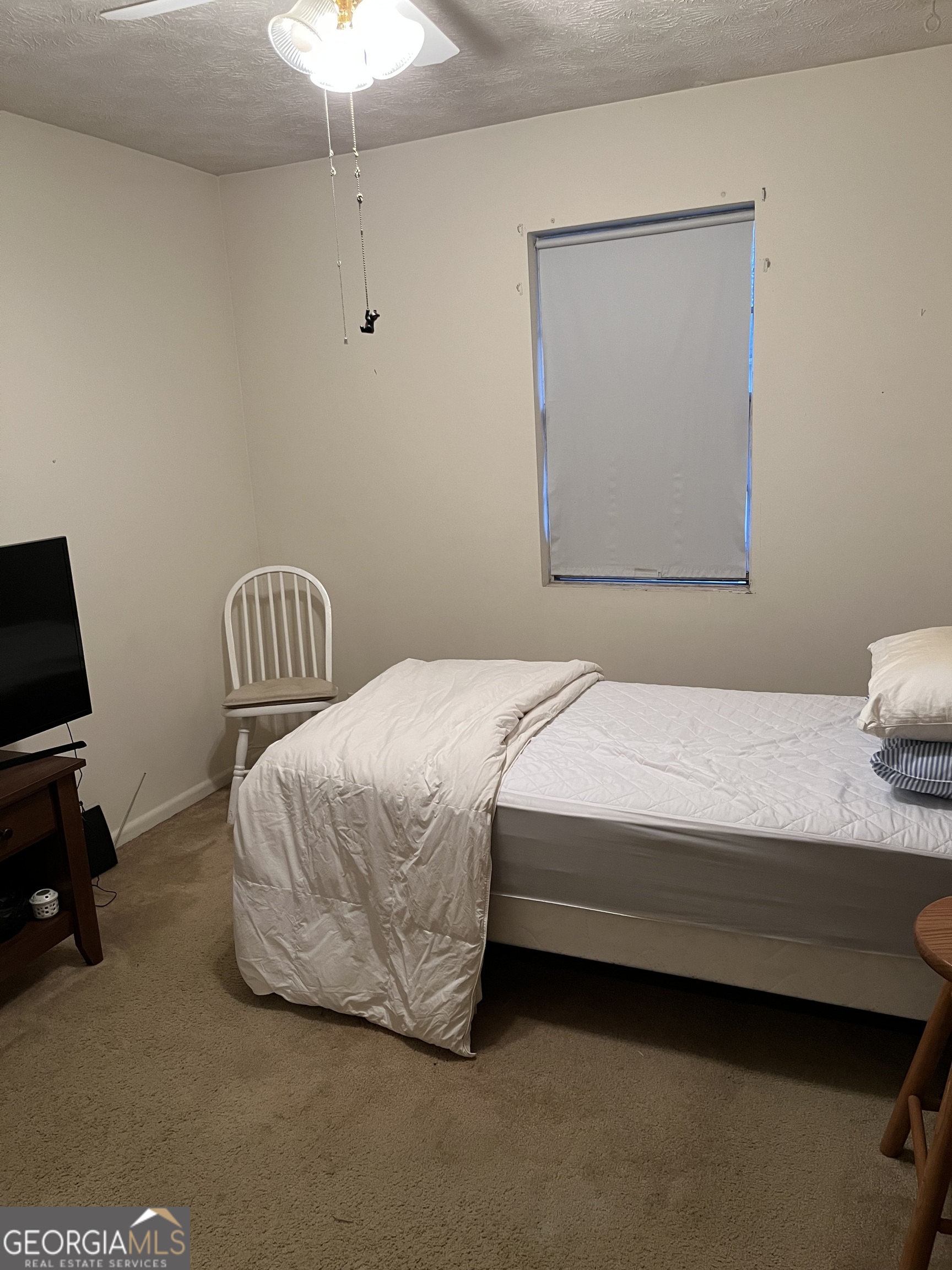 501 Carlton Road, Unit 4C Palmetto, GA 30268 - Photo 10 of 12 a bedroom with bed and a window