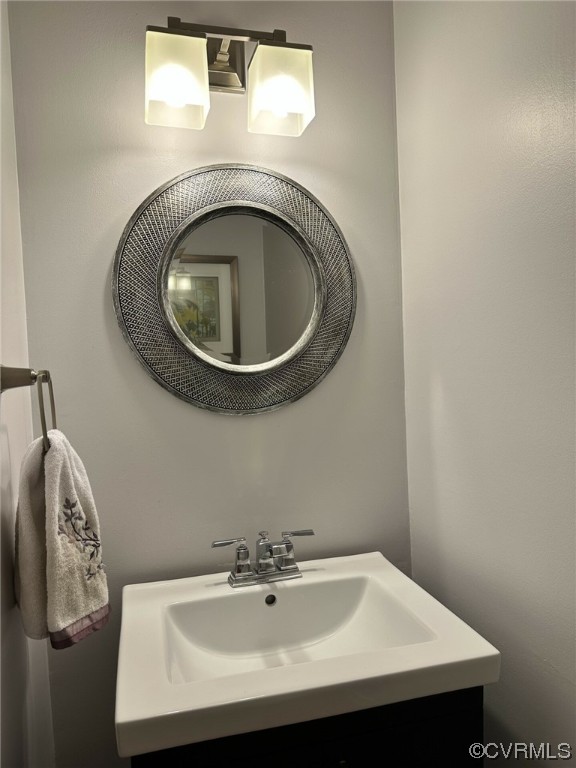 1811 Ducatus Drive Midlothian, VA 23113 - Photo 13 of 24 a bathroom with a sink and a mirror