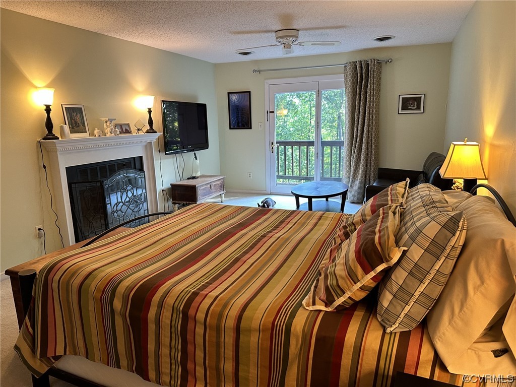 1811 Ducatus Drive Midlothian, VA 23113 - Photo 14 of 24 a bedroom with a bed and a fireplace