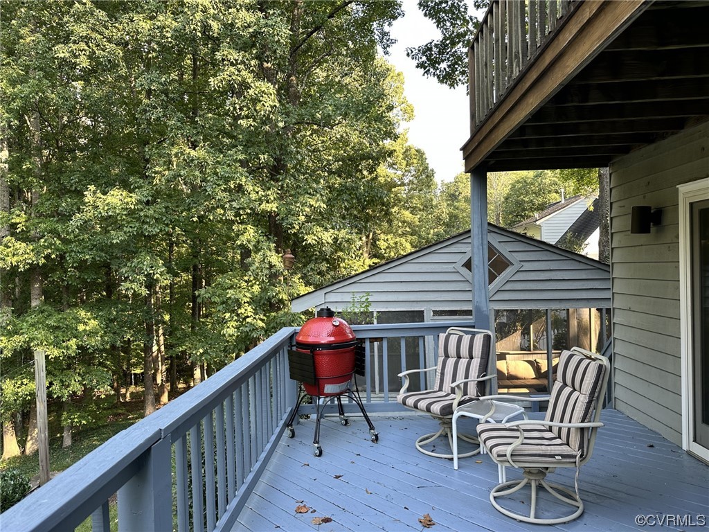1811 Ducatus Drive Midlothian, VA 23113 - Photo 21 of 24 a balcony with table and chairs