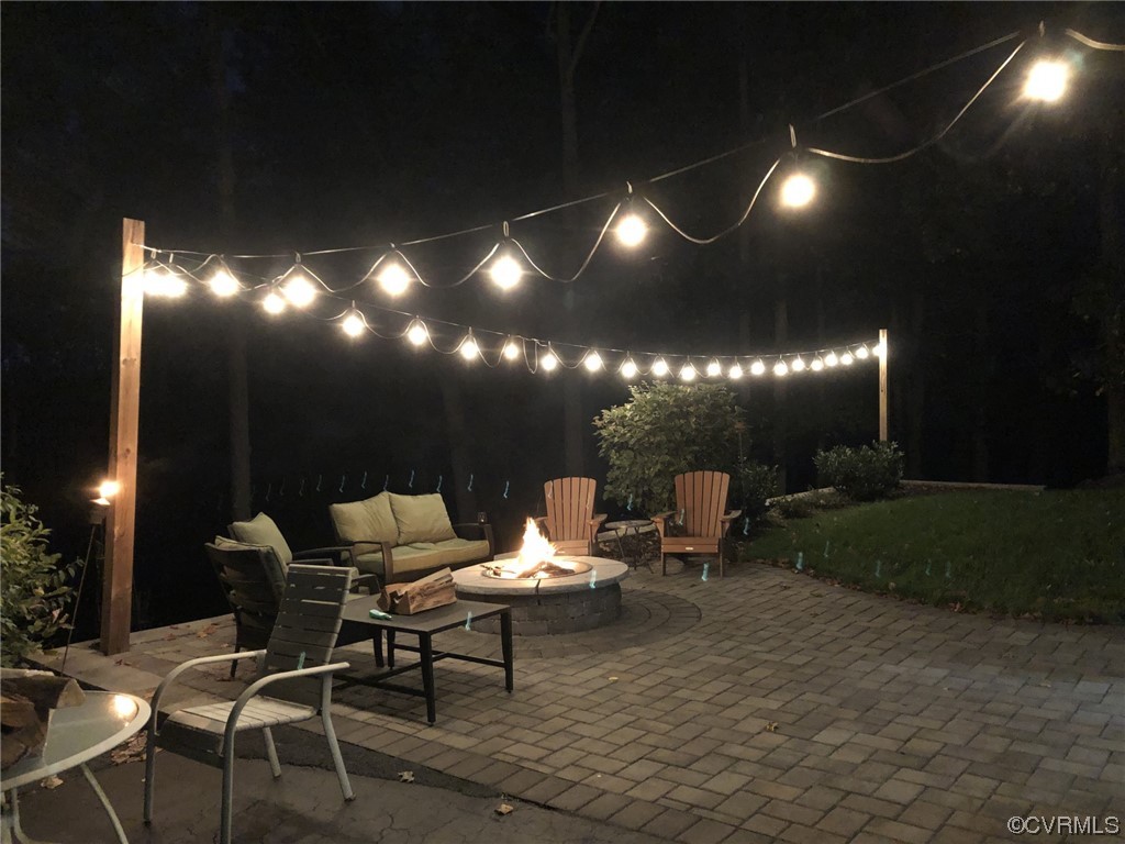 1811 Ducatus Drive Midlothian, VA 23113 - Photo 22 of 24 a outdoor space with lots of tables a chair and a fireplace