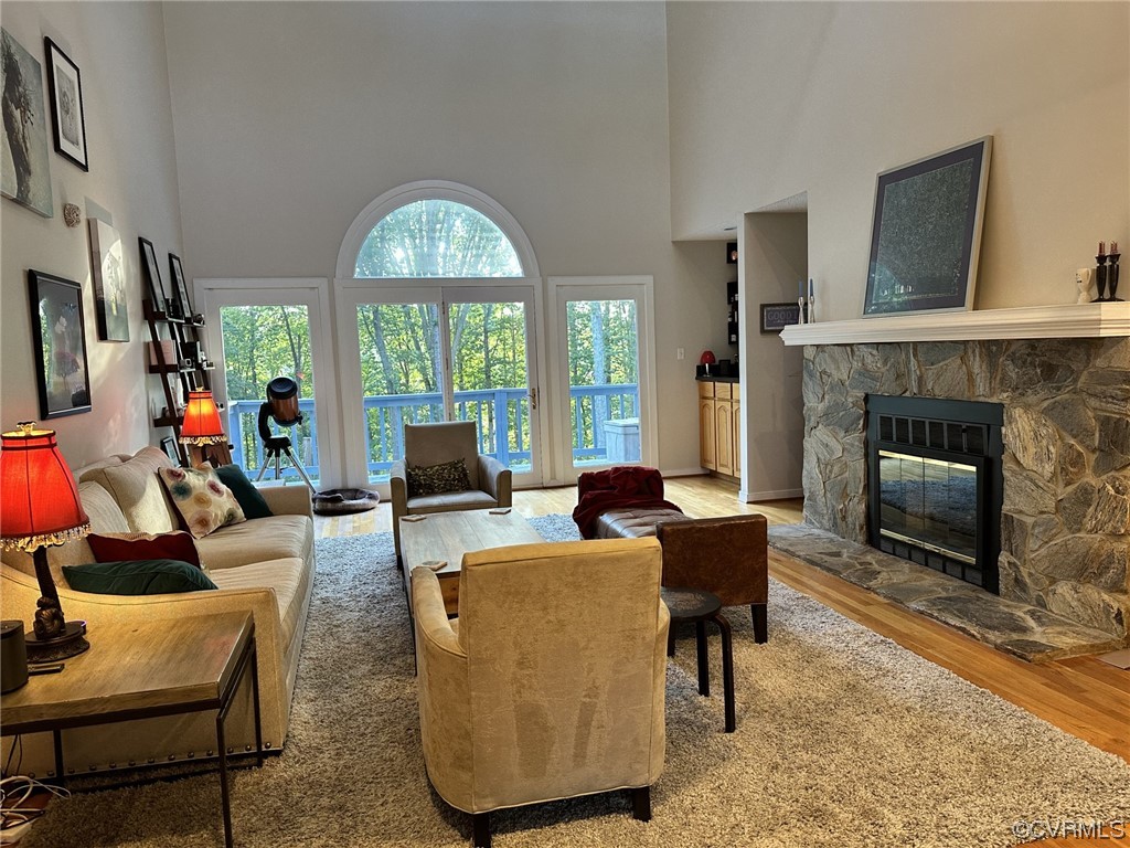 1811 Ducatus Drive Midlothian, VA 23113 - Photo 3 of 24 a living room with furniture a fireplace and a flat screen tv