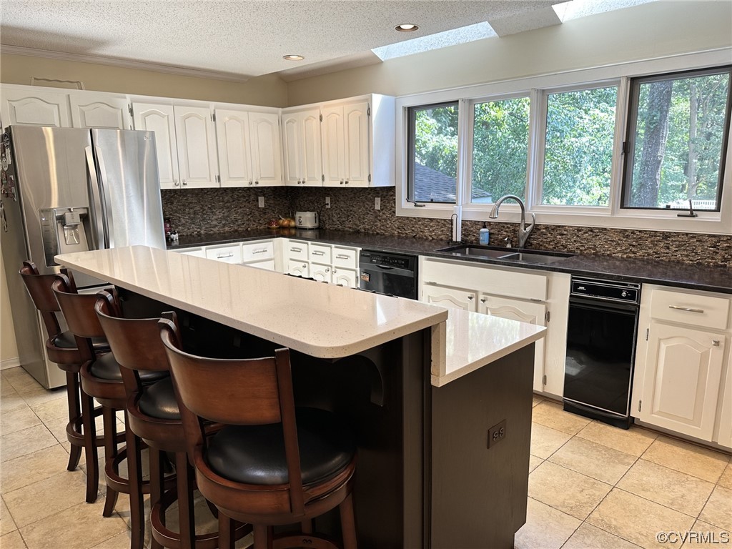 1811 Ducatus Drive Midlothian, VA 23113 - Photo 8 of 24 a kitchen with a stove a sink and a refrigerator