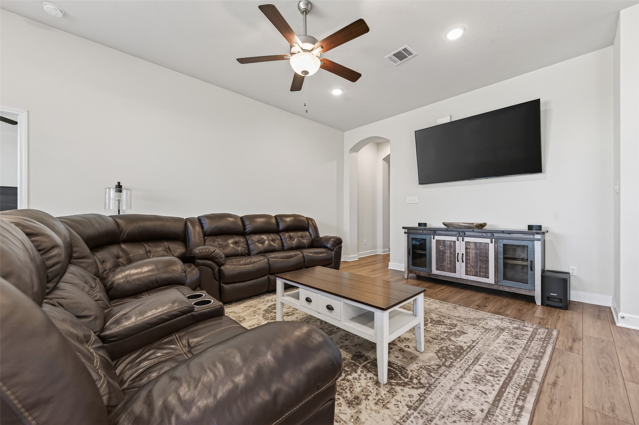 917 Farm Path Brenham, TX 77833 - Photo 9 of 43 a living room with furniture and a flat screen tv
