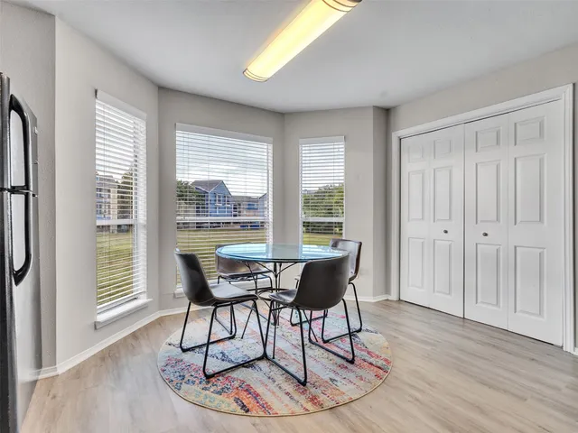 a dining room with furniture window wooden floor