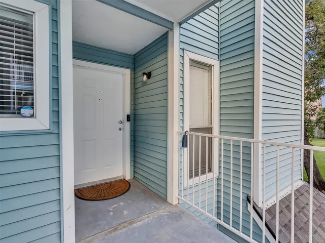 a view of a door and a window
