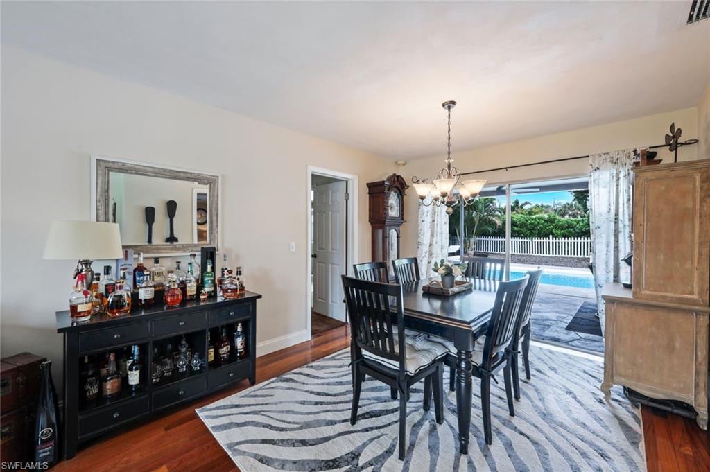 289 Burning Tree Drive Naples, FL 34105 - Photo 13 of 36 a view of a dining room with furniture and window