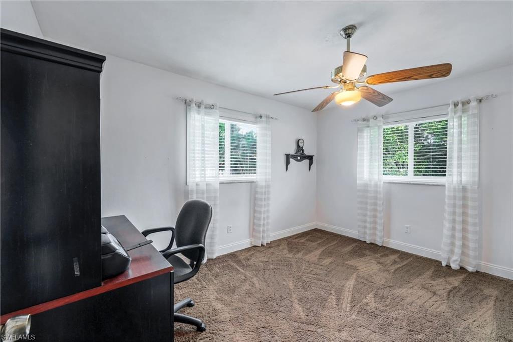 289 Burning Tree Drive Naples, FL 34105 - Photo 20 of 36 a workspace with furniture and a window