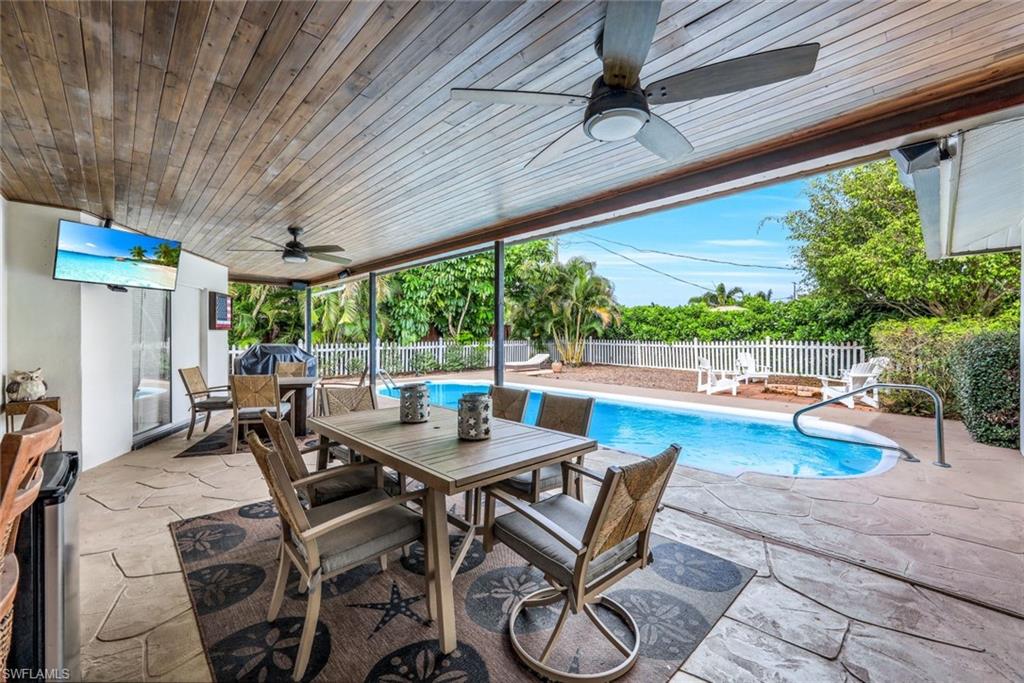 289 Burning Tree Drive Naples, FL 34105 - Photo 23 of 36 a outdoor space with a table and chairs