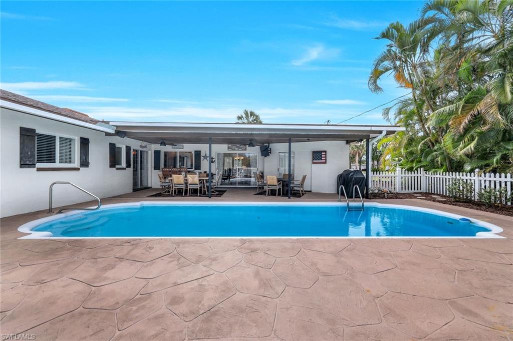 289 Burning Tree Drive Naples, FL 34105 - Photo 28 of 36 a view of house and outdoor space with swimming pool