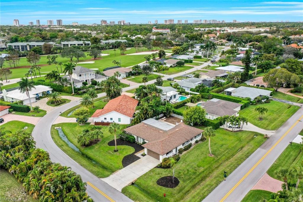 289 Burning Tree Drive Naples, FL 34105 - Photo 30 of 36 an aerial view of residential houses with outdoor space
