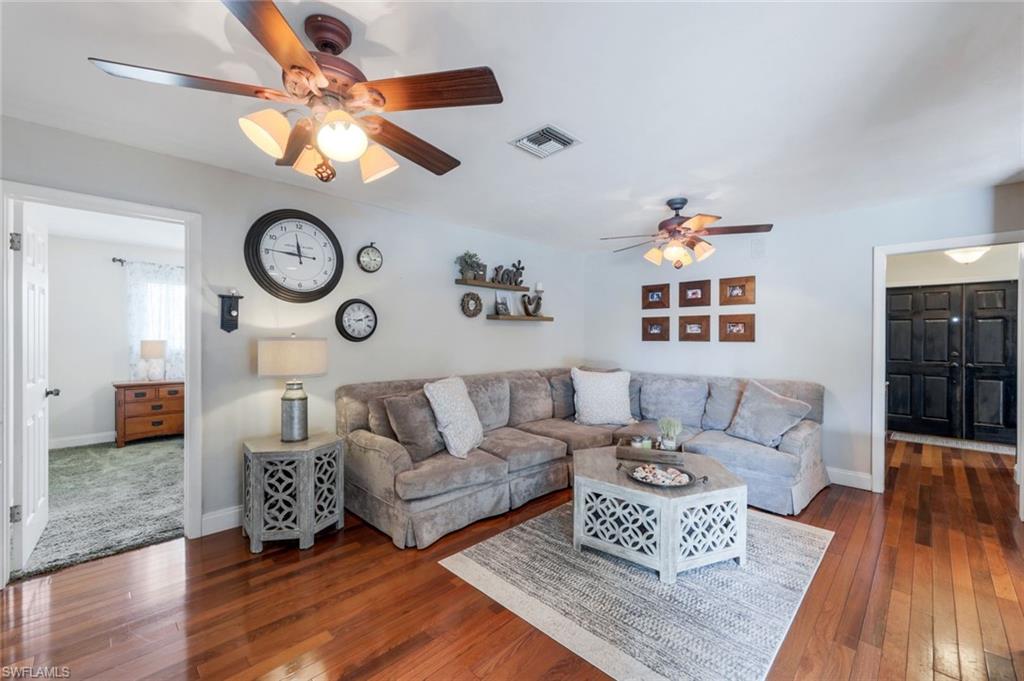 289 Burning Tree Drive Naples, FL 34105 - Photo 3 of 36 a living room with furniture and a large window
