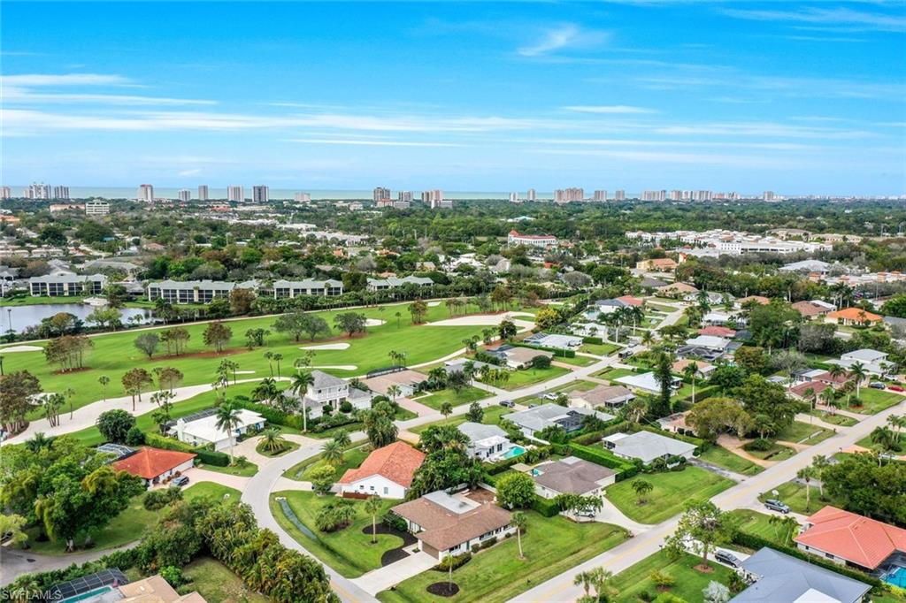 289 Burning Tree Drive Naples, FL 34105 - Photo 34 of 36 an aerial view of residential houses with outdoor space